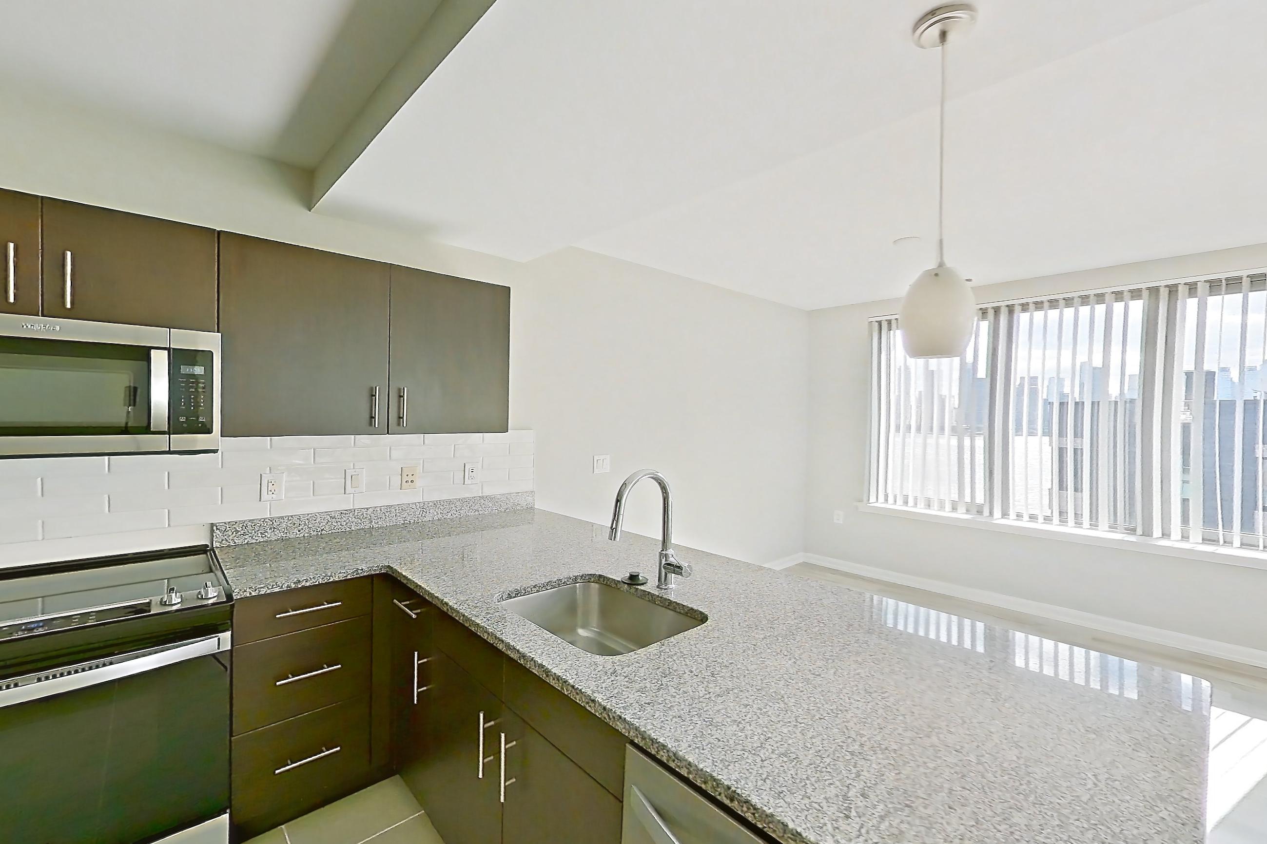 Kitchen in Apartment rt-1122 at RiverTrace at Port Imperial, C3 floor plan
