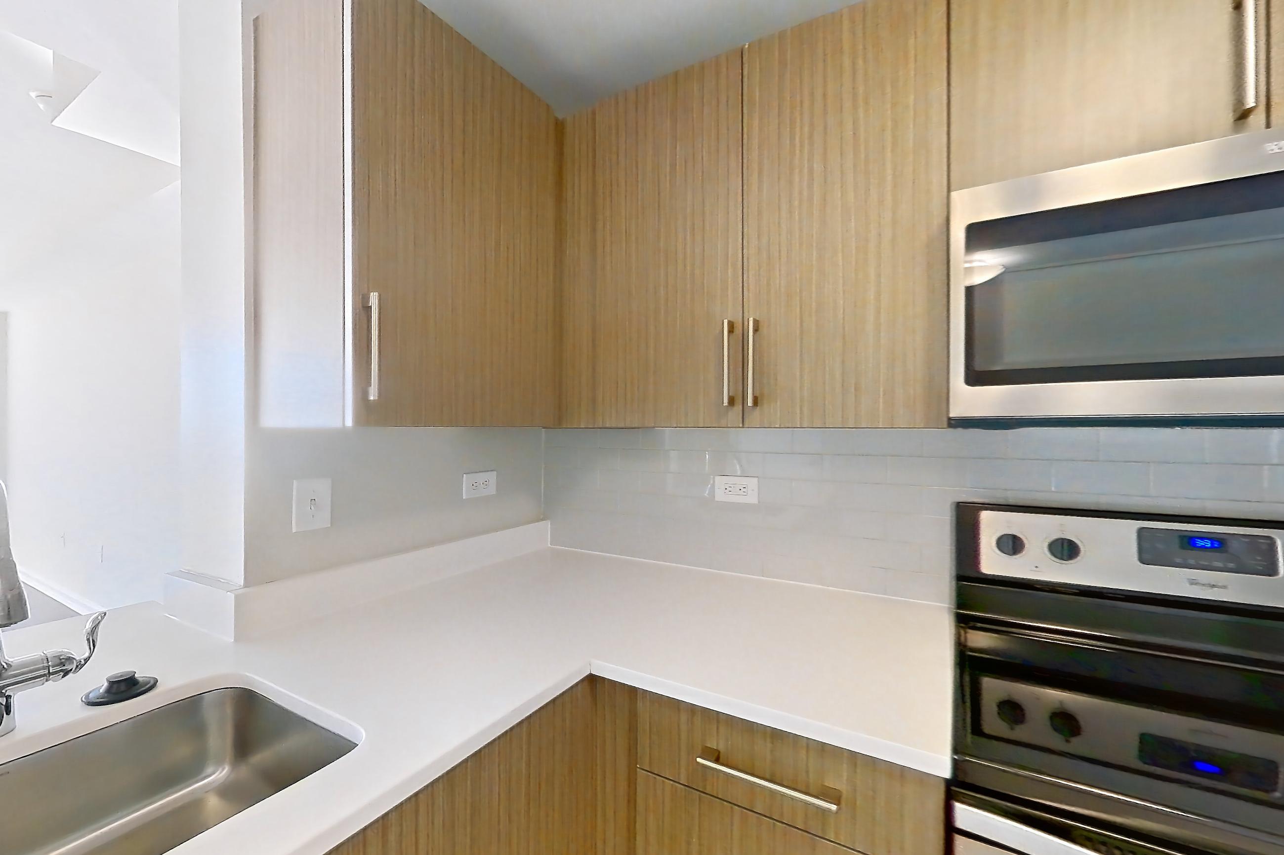Kitchen in Apartment m2-3808 at BLVD Collection - 401 Washington Blvd, m2-b7 floor plan