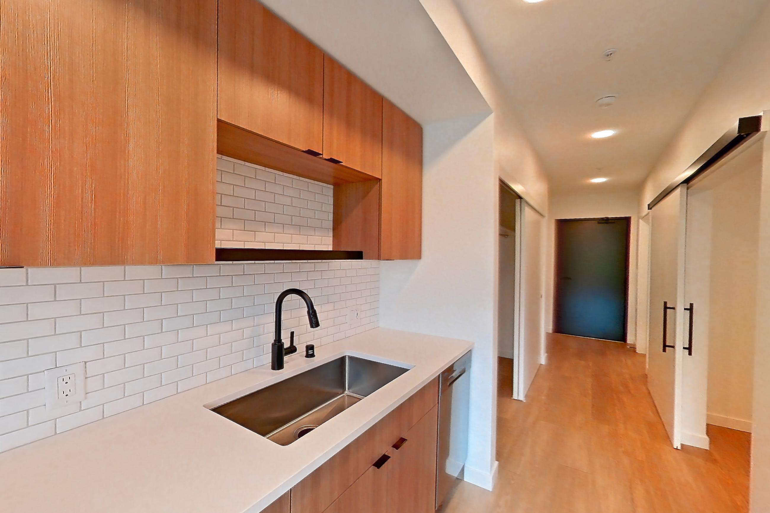 Kitchen in Apartment 515 at Ballard Yards, A1 floor plan
