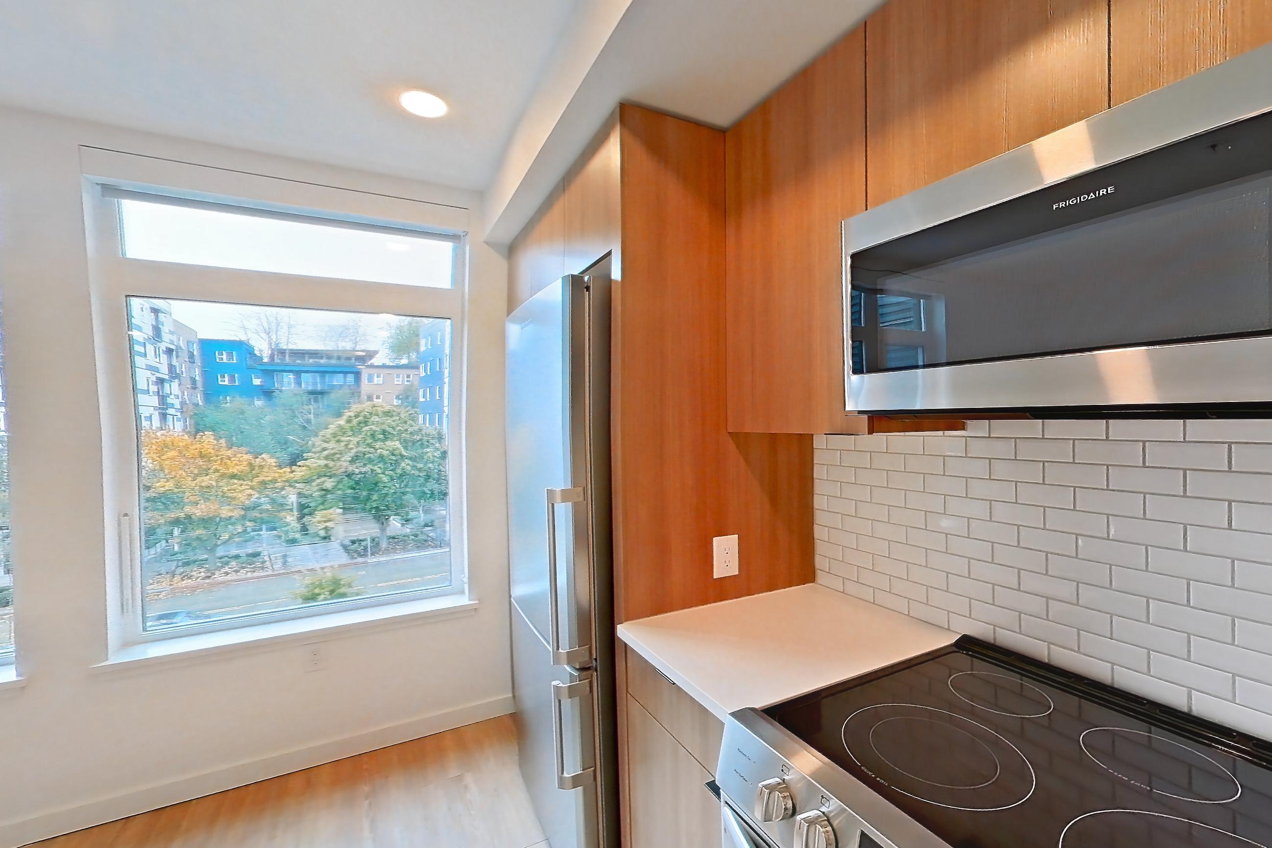 Kitchen in Apartment 515 at Ballard Yards, A1 floor plan