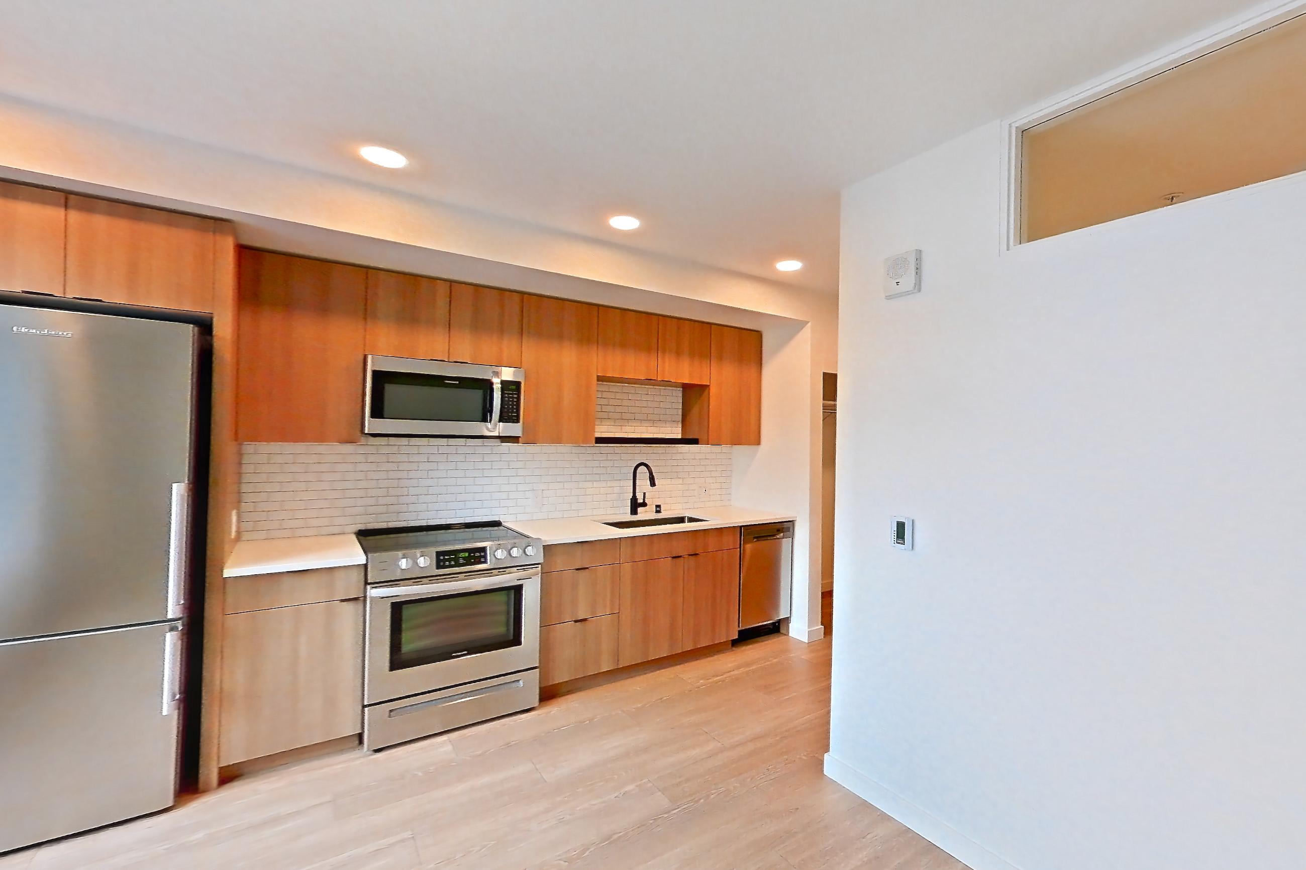Living room, Apartment 515 at Ballard Yards