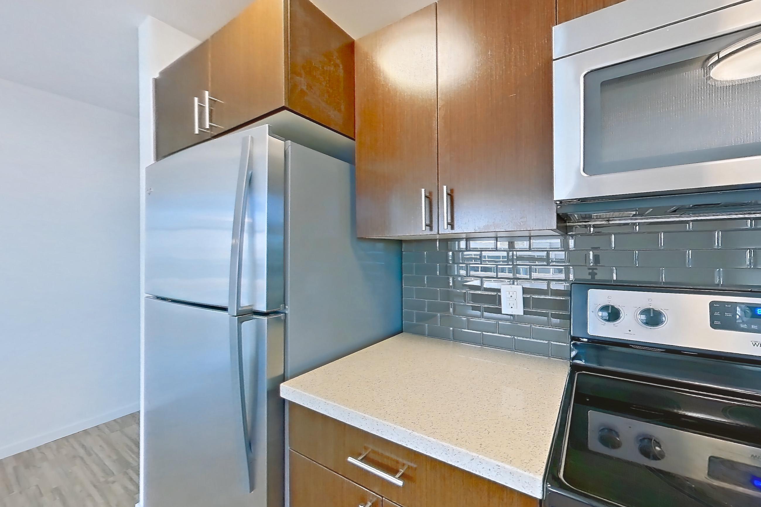 Kitchen island in Apartment l600 at Union SLU, Marquis floor plan