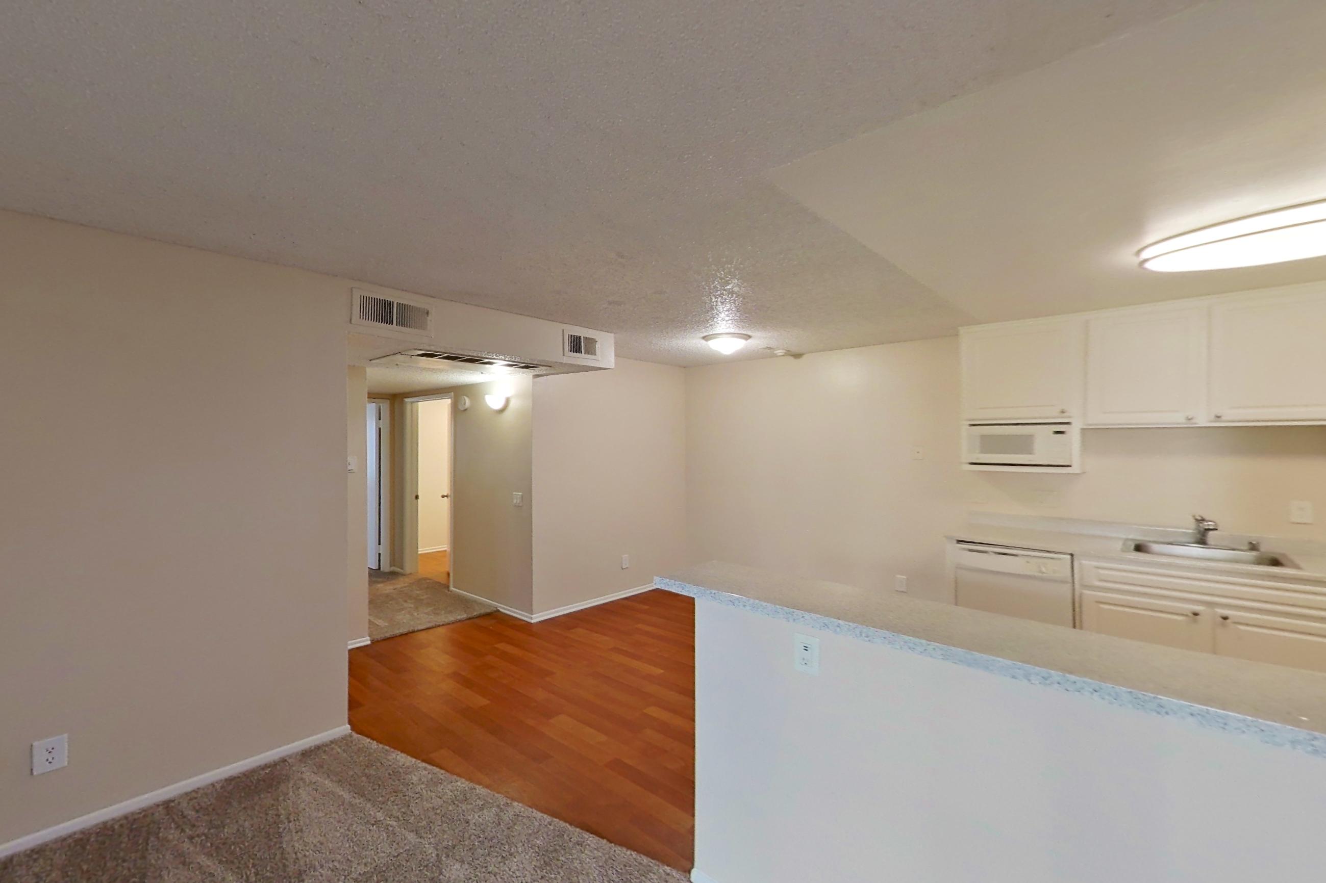 Living space with dishwasher and white appliances, Apartment 16-16 at Avana Rancho Cucamonga