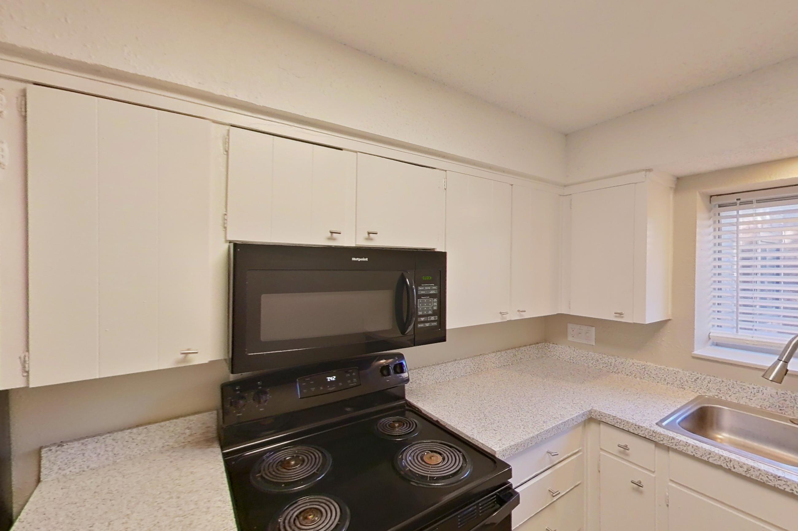 Kitchen in a 2x2 E Elite floor plan apartment, representative of Apartment 1426C at The Life at Legacy Fountains