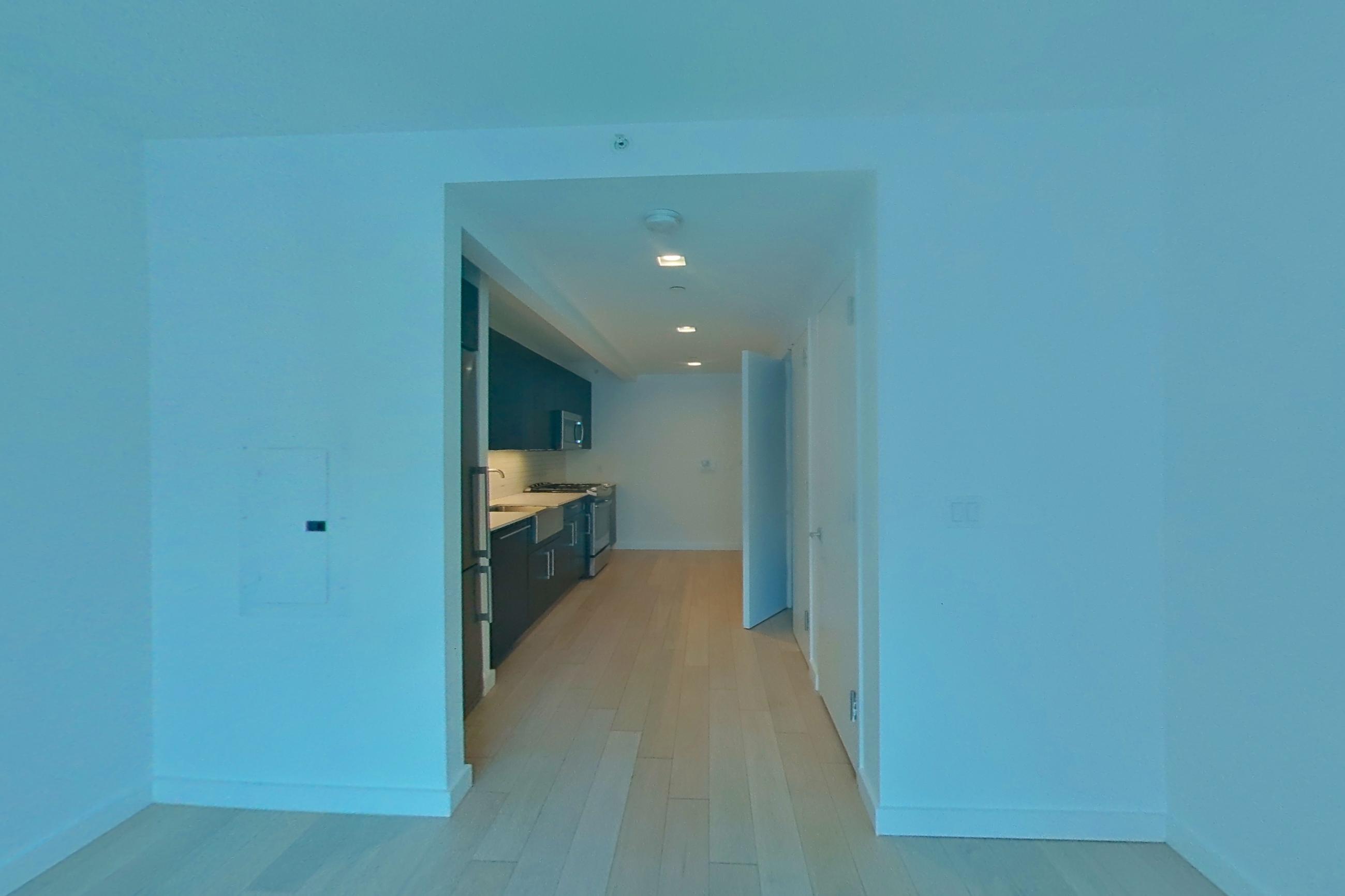Living space with gas range, light wood-finish flooring, oven/range, and stainless steel appliances, Apartment N-10M at 535W43