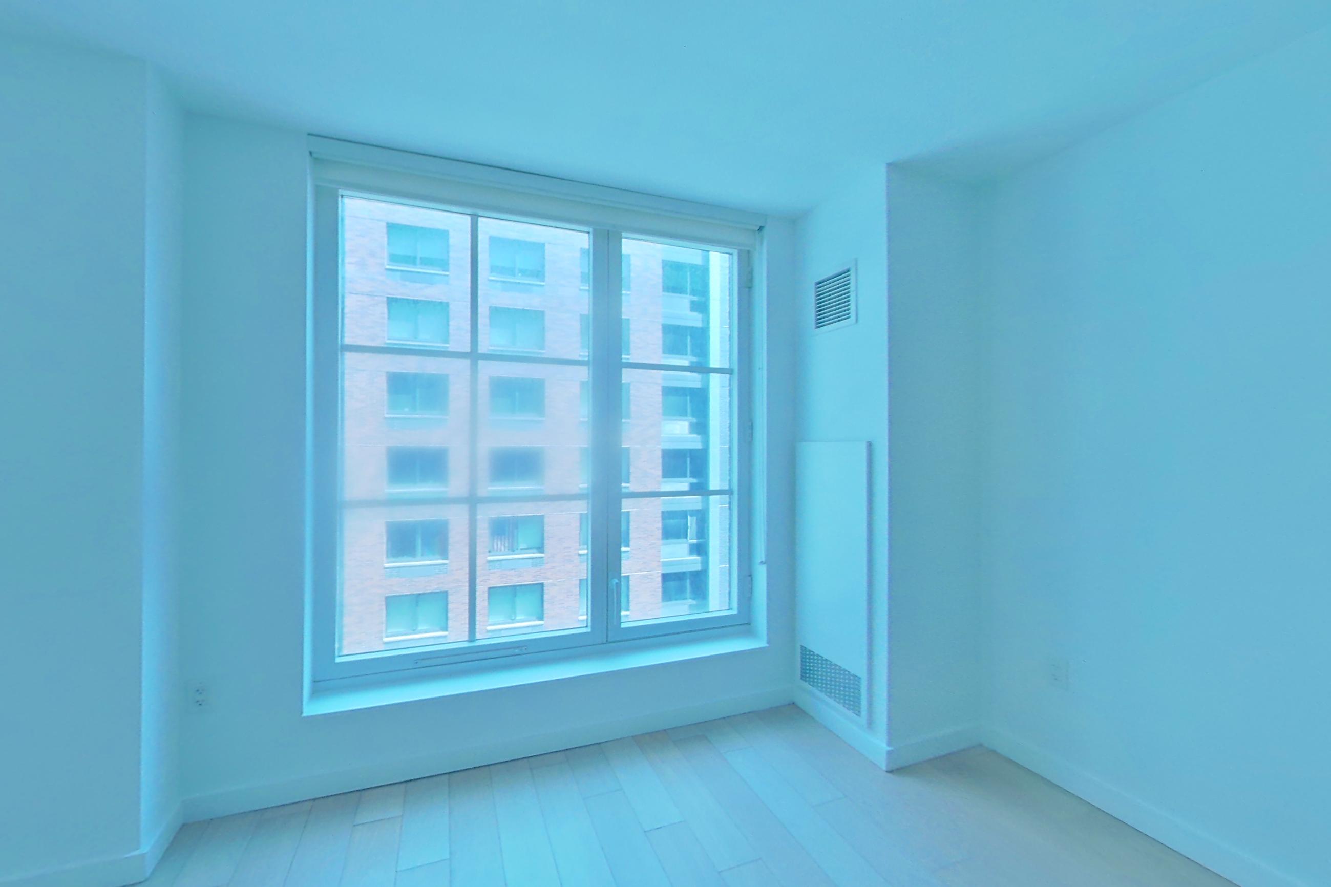 Living space with light wood-finish flooring, Apartment N-6M at 535W43