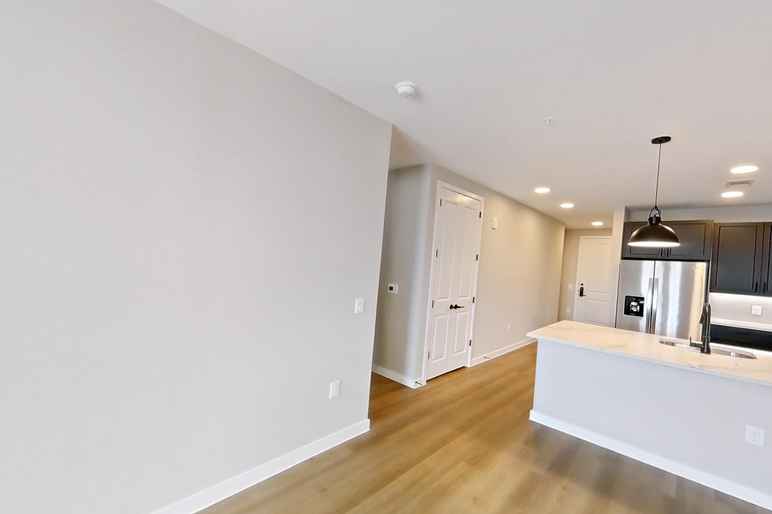 Living room with light wood-finish flooring, Apartment 621 at The Willow