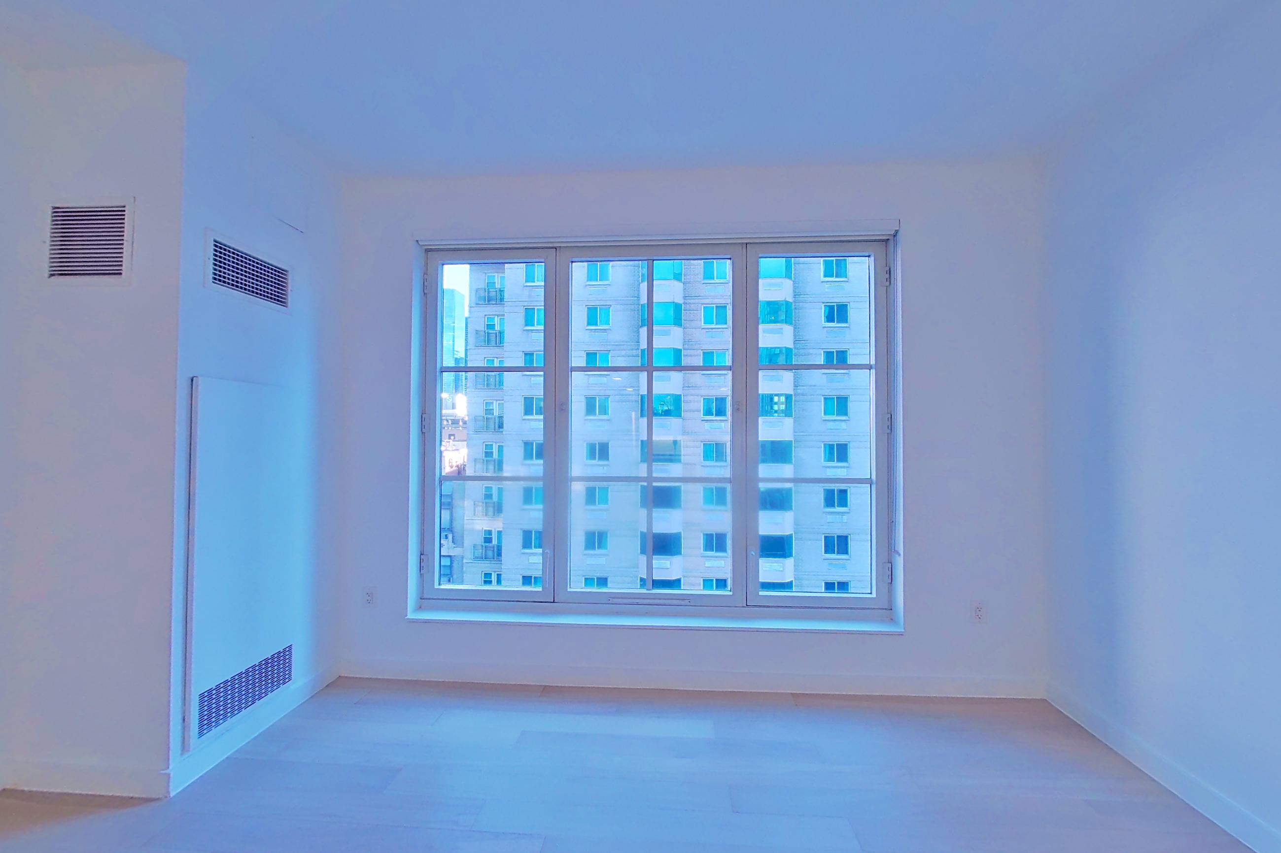 Living room with light wood-finish flooring, Apartment SOUTH PHA at 535W43