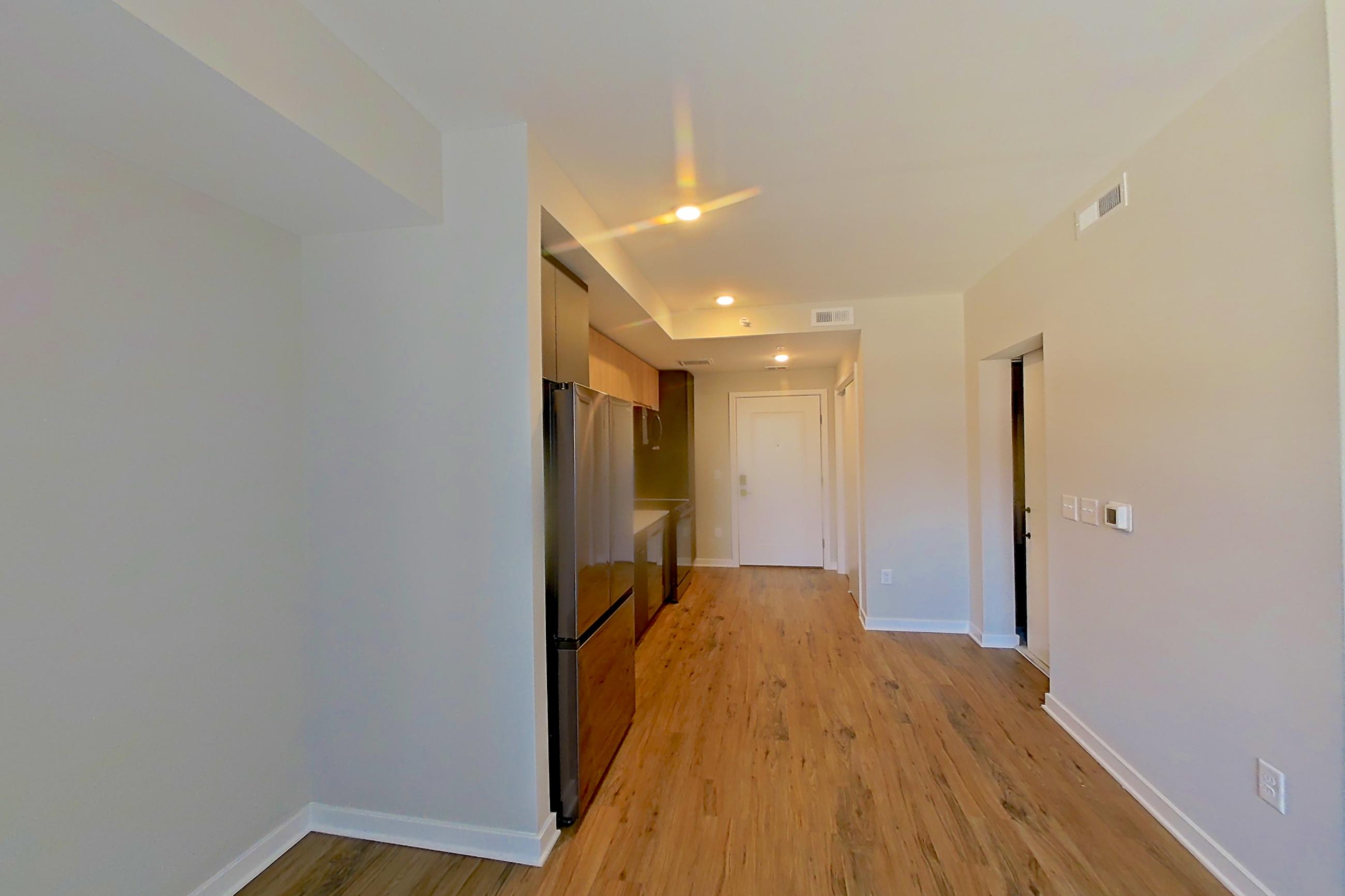 Living space with light wood-finish flooring, Apartment 441 at Urba
