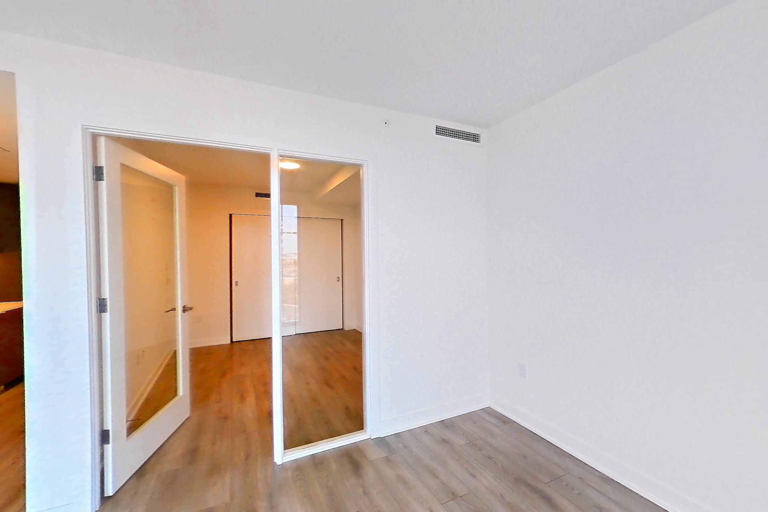 Living room with light wood-finish flooring, Apartment 1111 at Theory