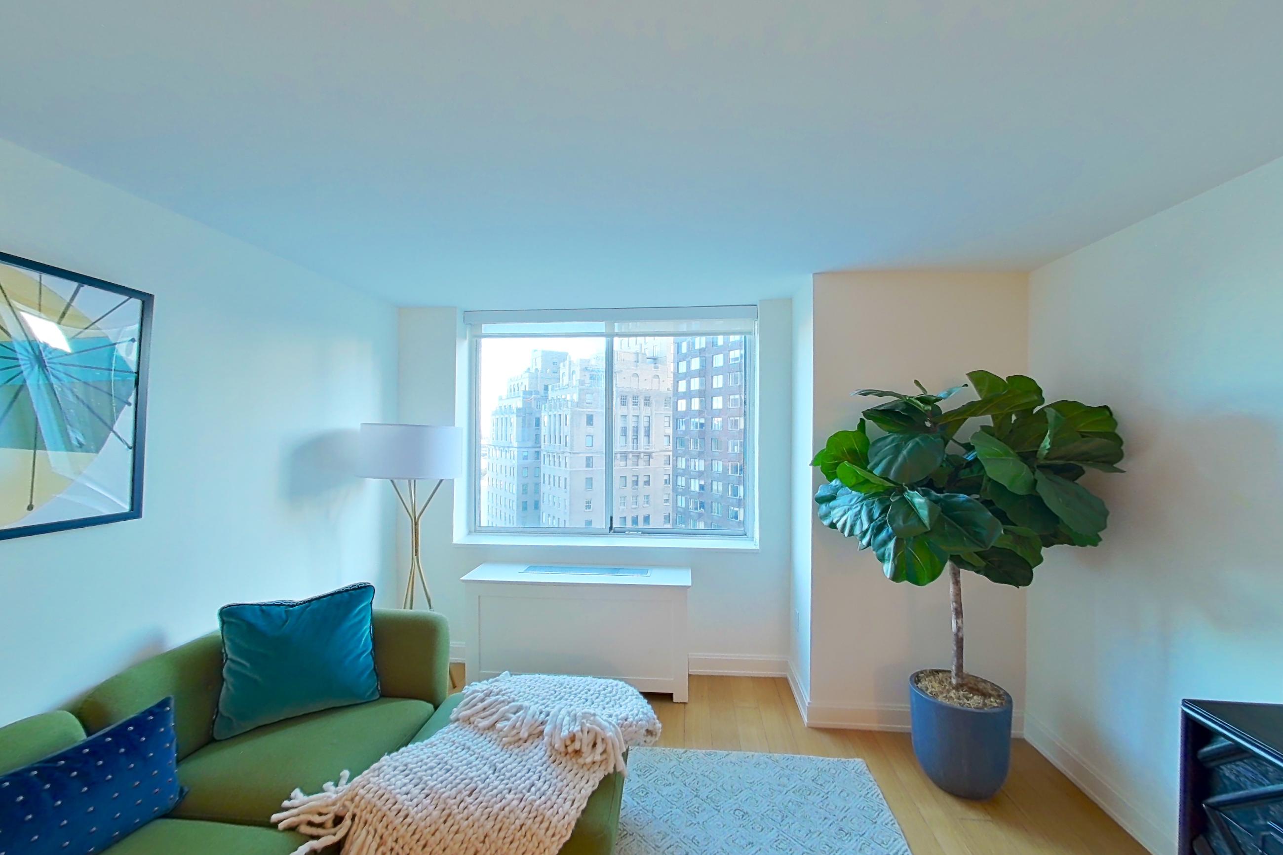 Living room with city view, Apartment 1703 at Oriana