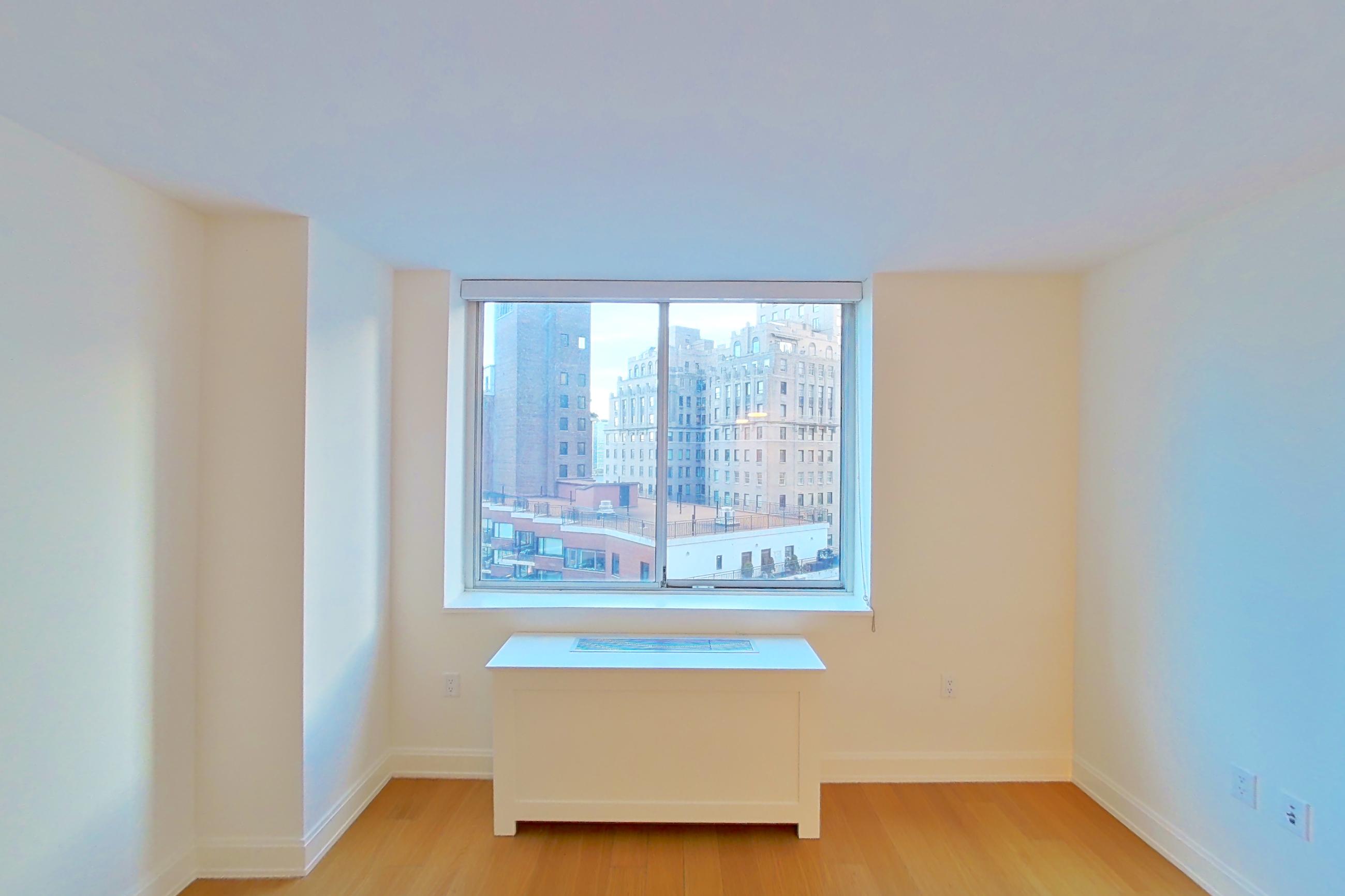 Living space with light wood-finish flooring, Apartment 1414 at Oriana