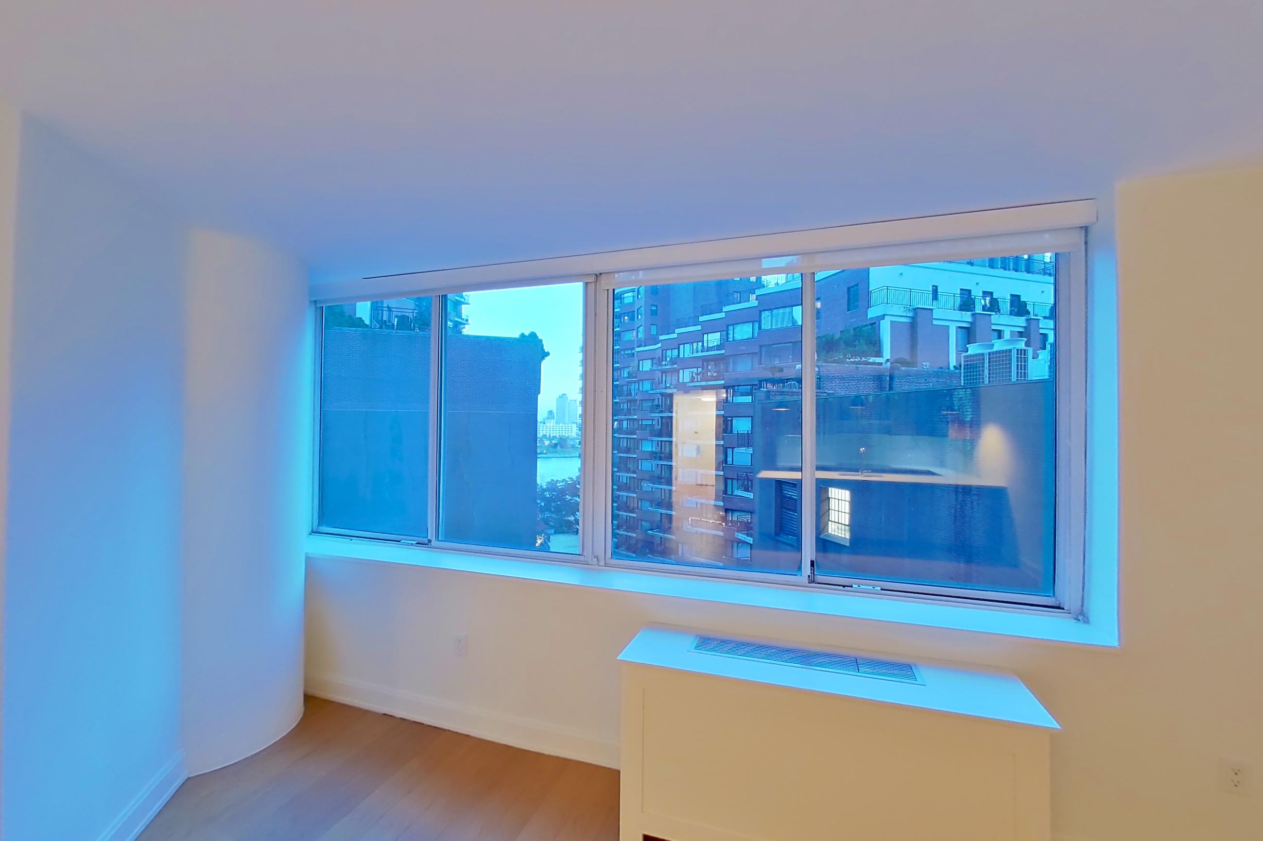 Living room with light wood-finish flooring, Apartment 0711 at Oriana