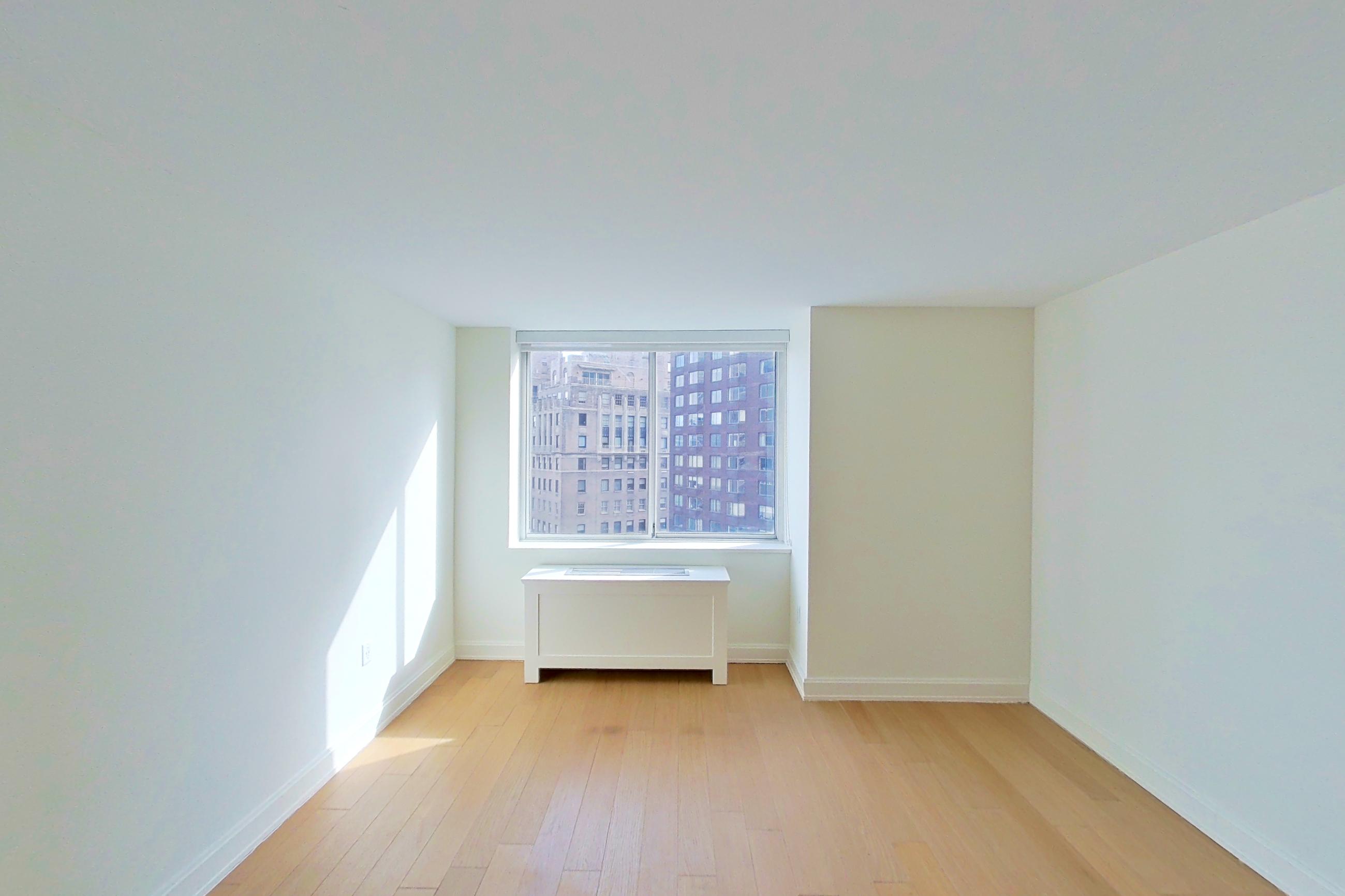 Living room with light wood-finish flooring and wood-finish flooring, Apartment 1603 at Oriana