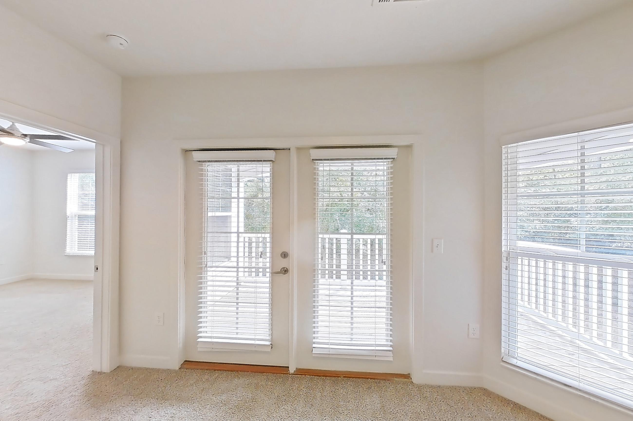 Living room with light carpet, Apartment 208 at Realm at Patterson Place