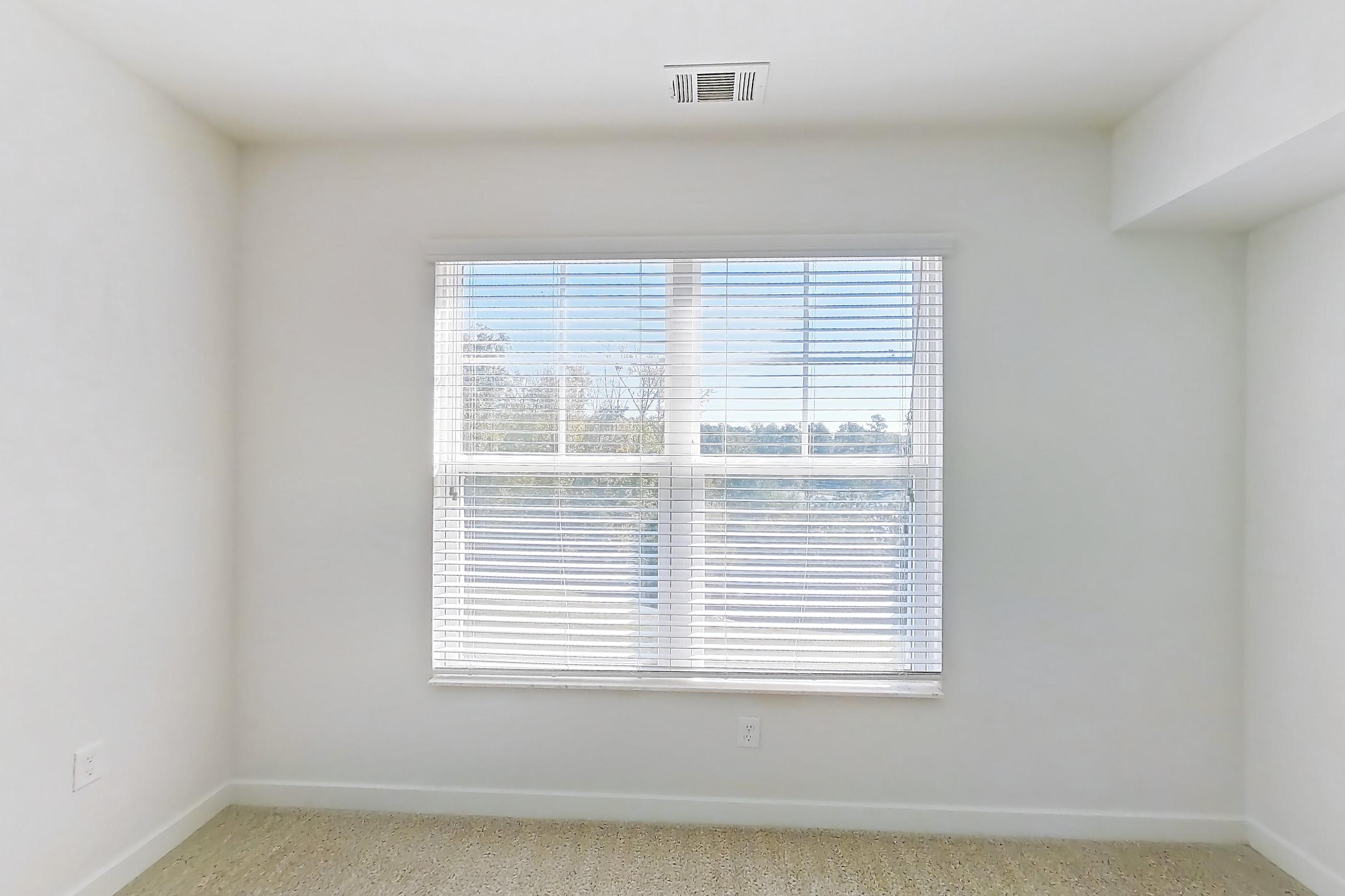 Living room with light carpet, Apartment 101 at Realm at Patterson Place