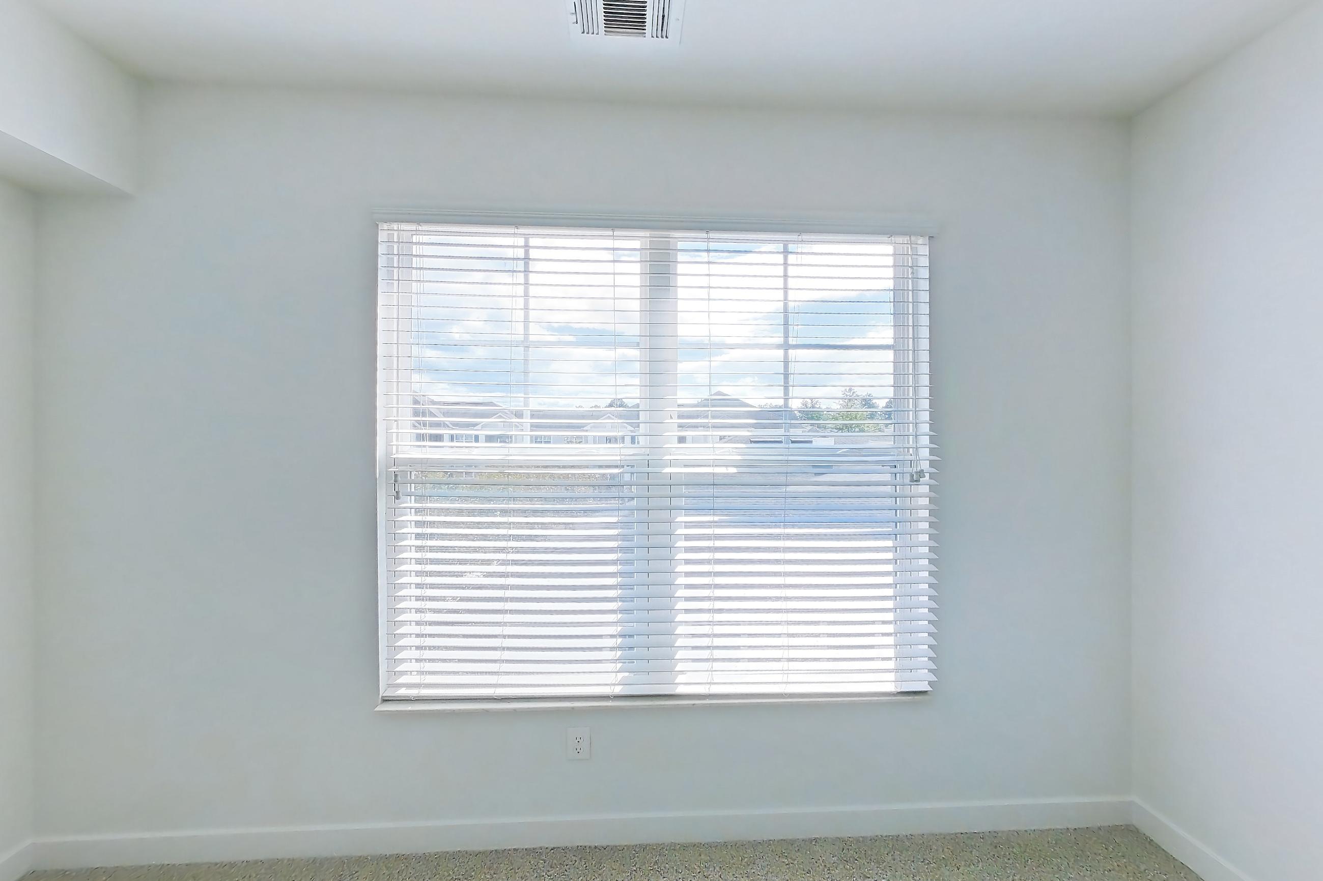 Living room with light carpet, Apartment 306 at Realm at Patterson Place