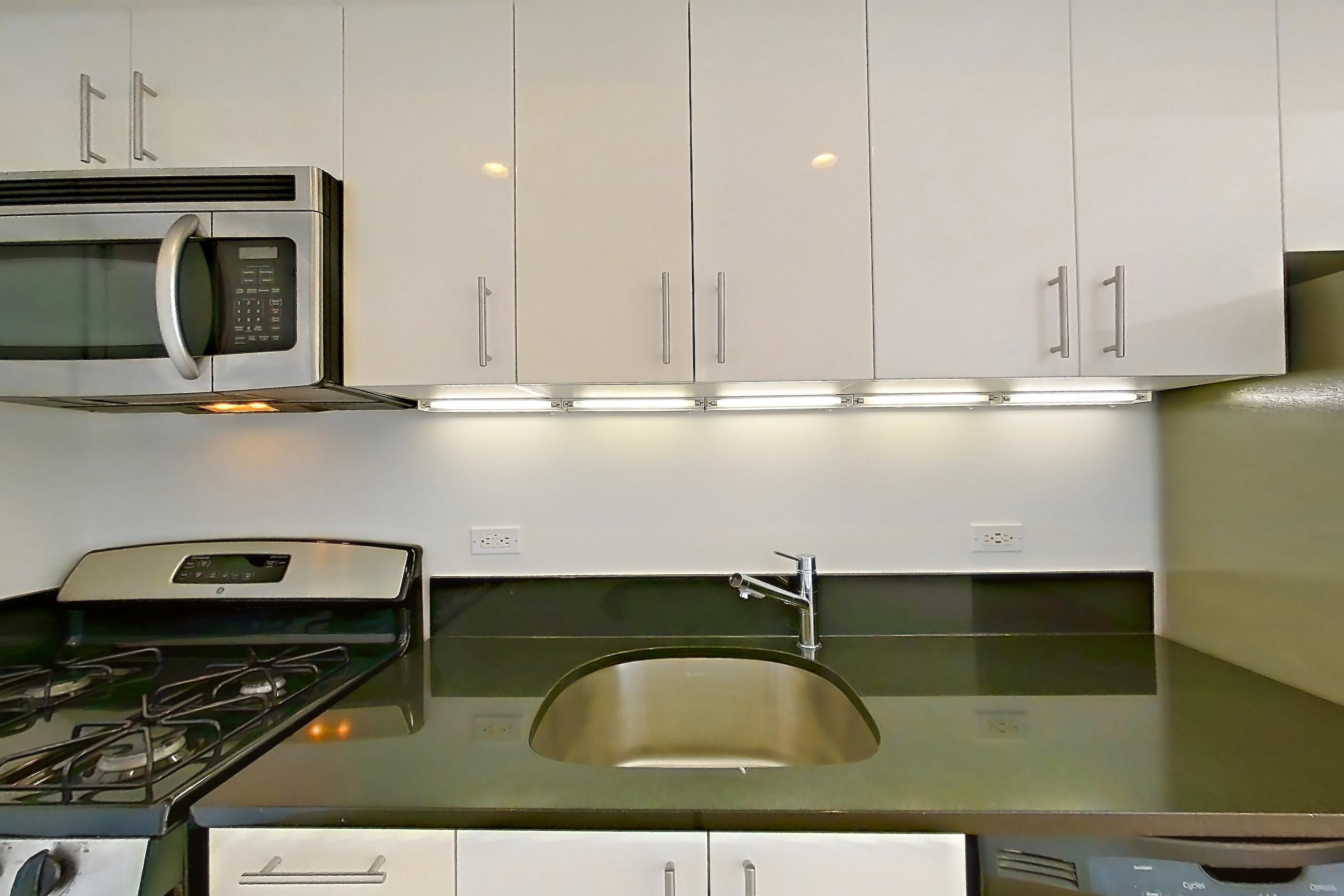 Kitchen in Apartment 27d at The Addison, Studio 1 bath floor plan