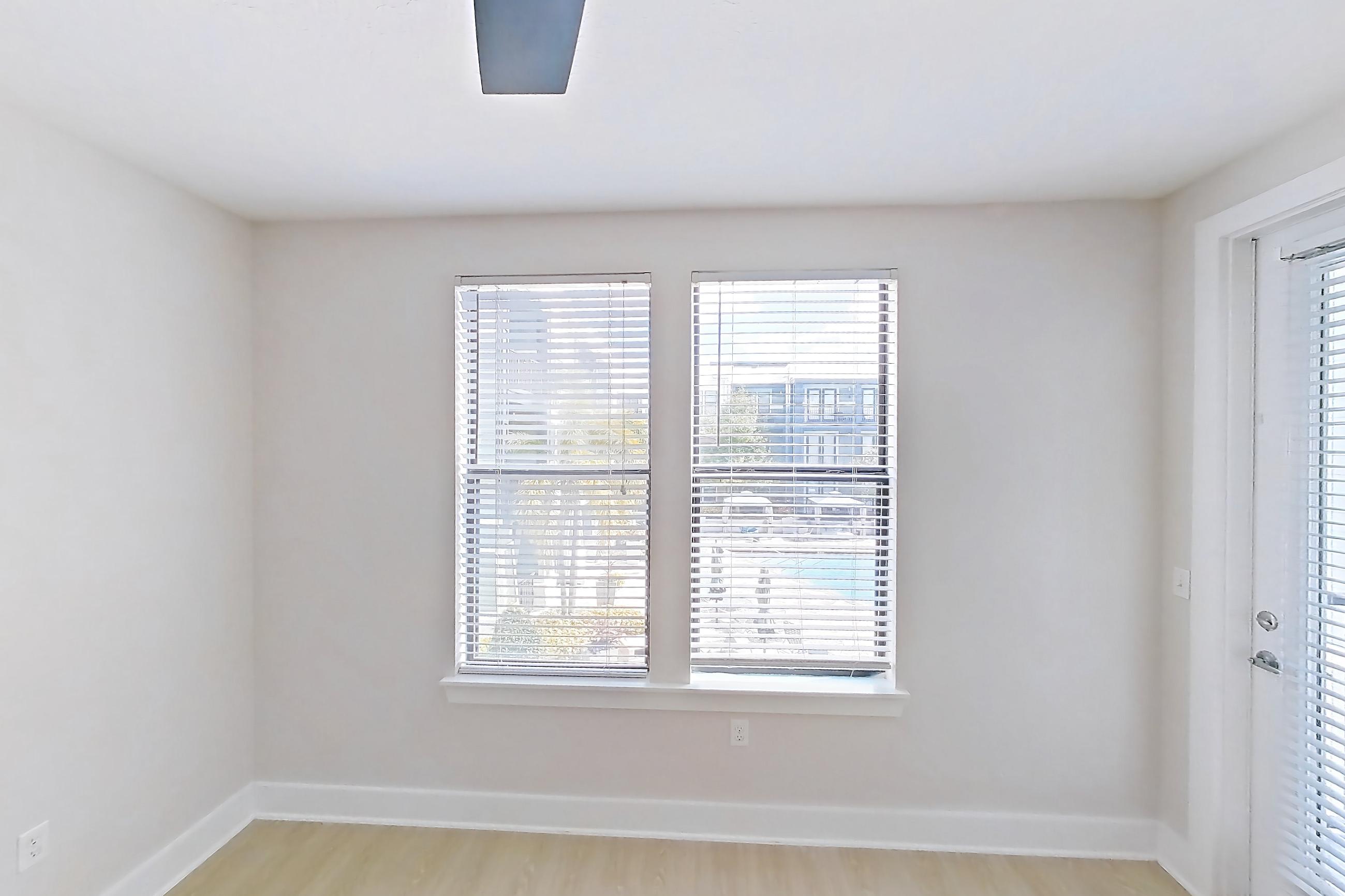 Living room with light wood-finish flooring, Apartment 3233 at NoHo Flats