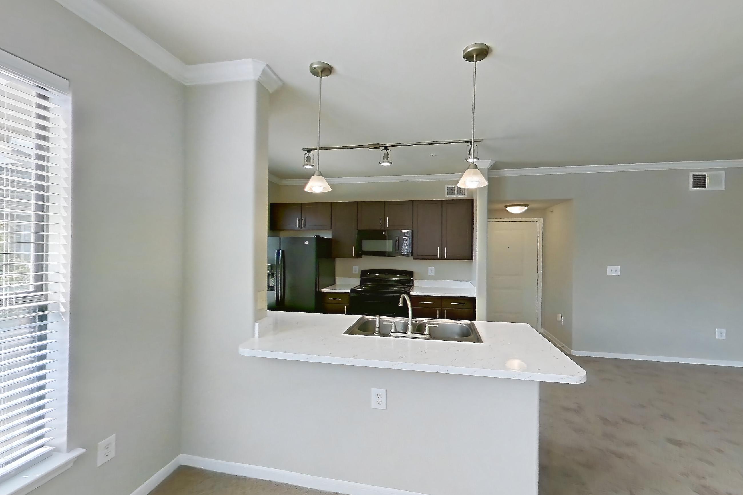 Dining room in Apartment 1032 at Marquis at Sugar Land, 2B floor plan