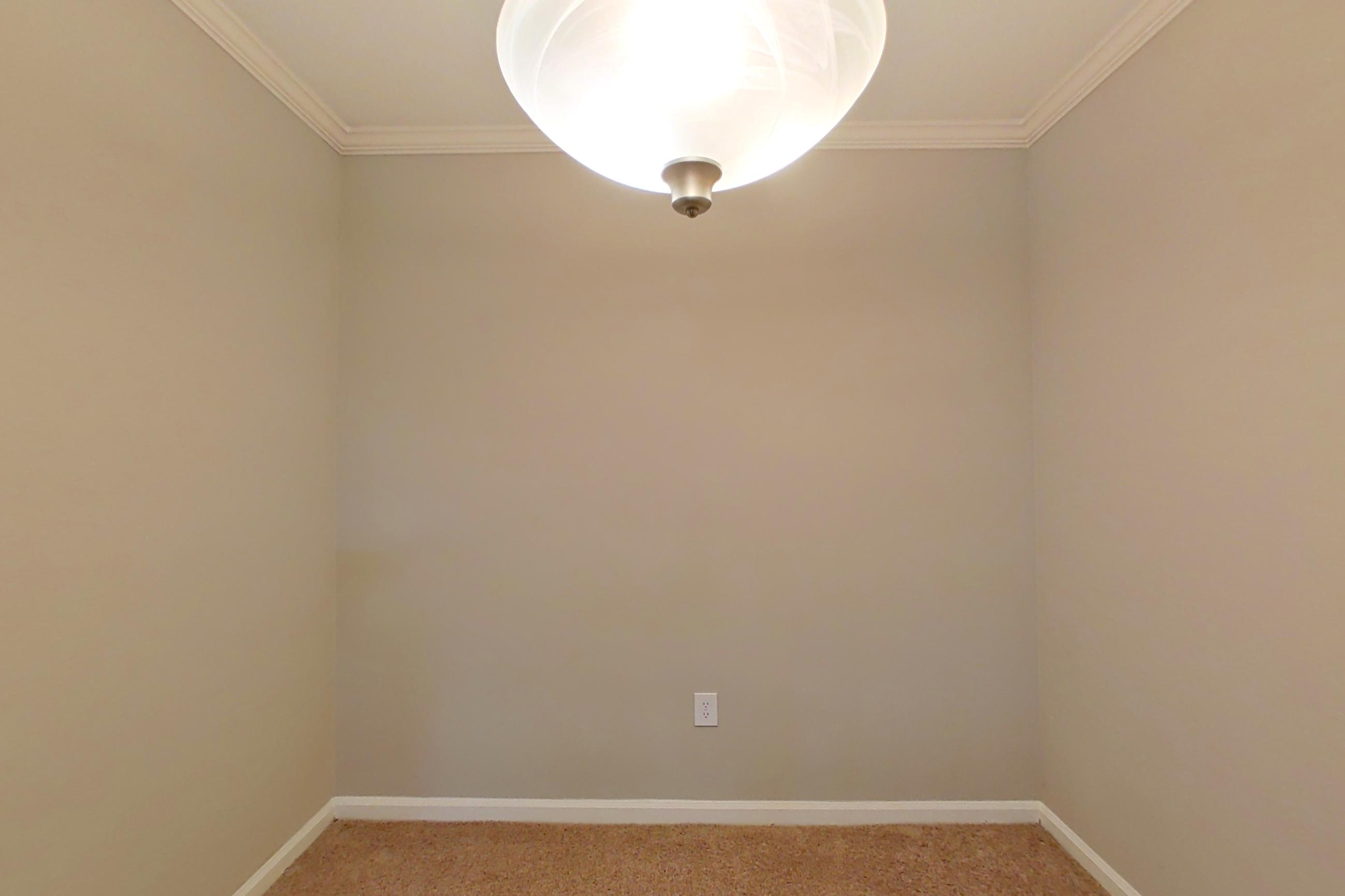 Dining area with light carpet, Apartment 0120 at The Marq at Brookhaven