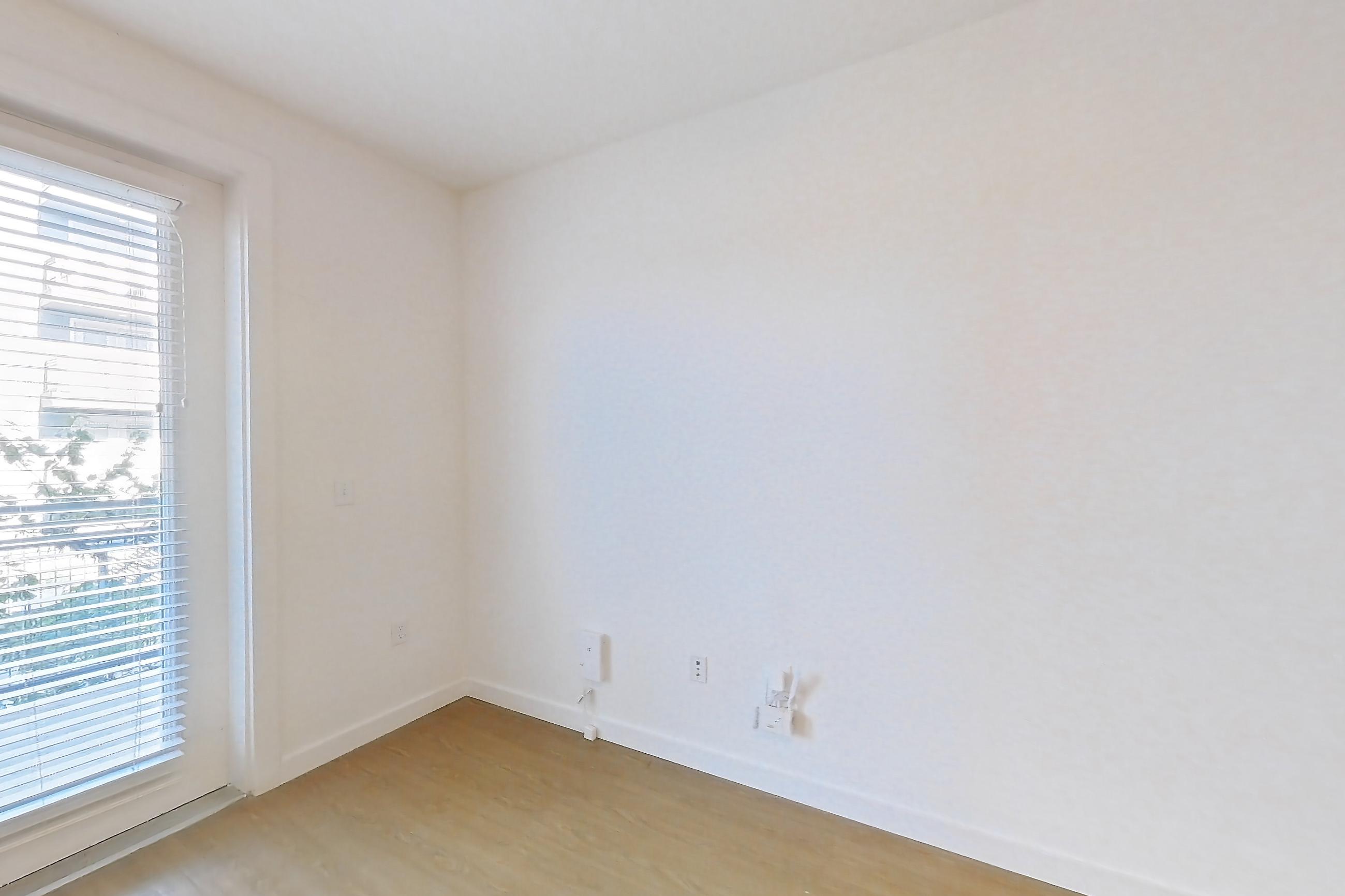 Living space with light wood-finish flooring, Apartment 2203 at 44 South