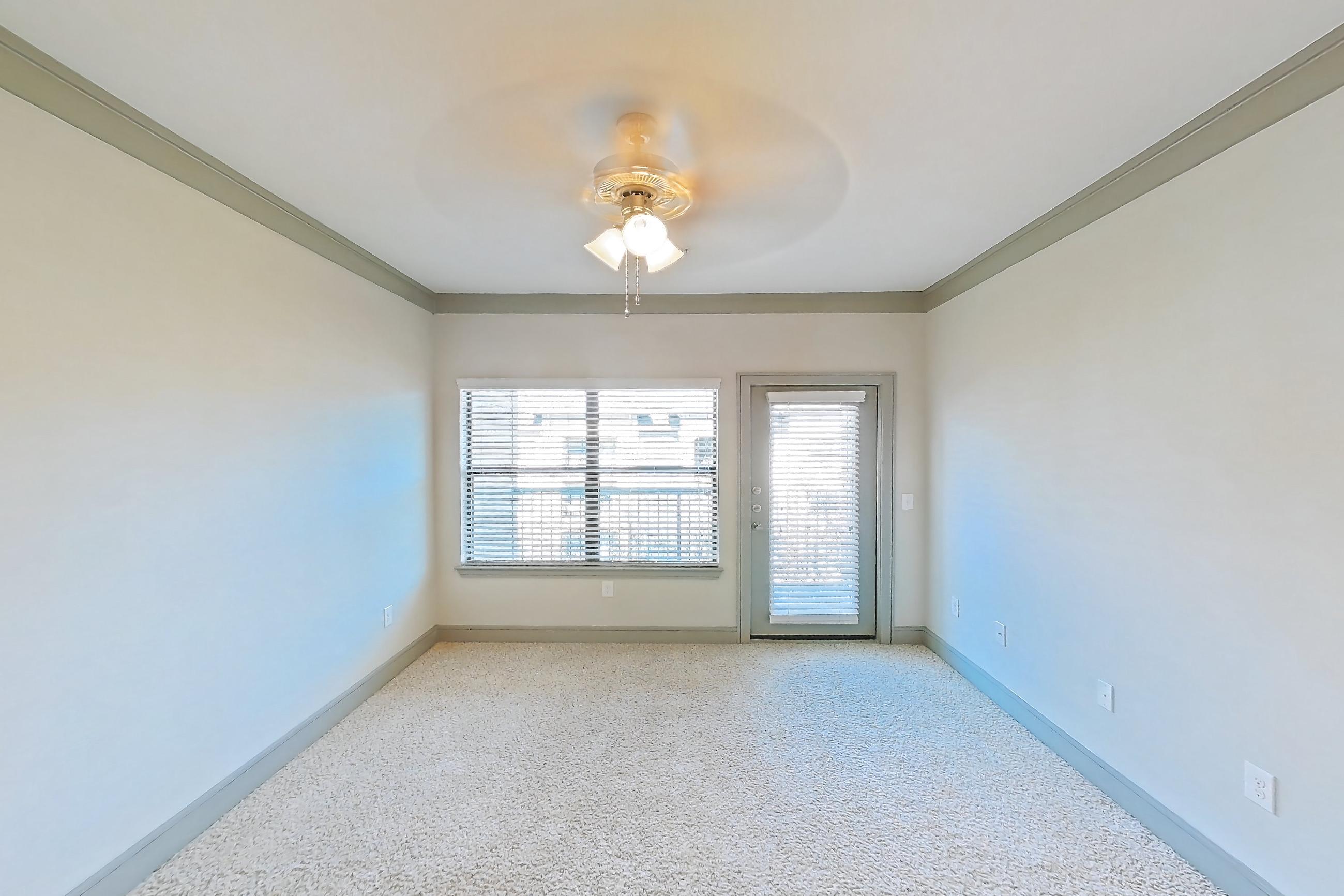 Living space with electric range, light carpet, light stone countertops, oven/range, and stainless steel appliances, Apartment 3312 at Marquis Seven Meadows
