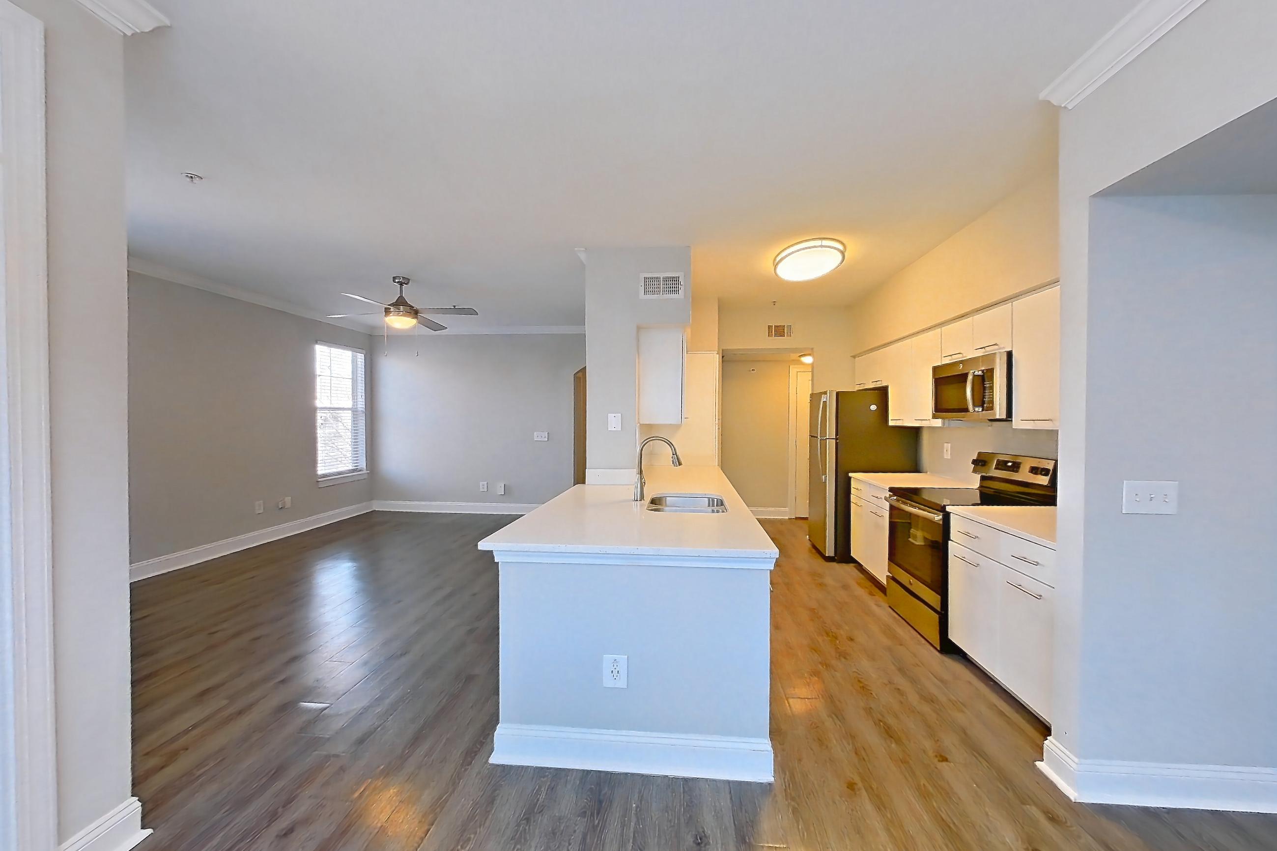 Dining room with electric range, light countertops, oven/range, and stainless steel appliances, Apartment 6336 at Marq Perimeter