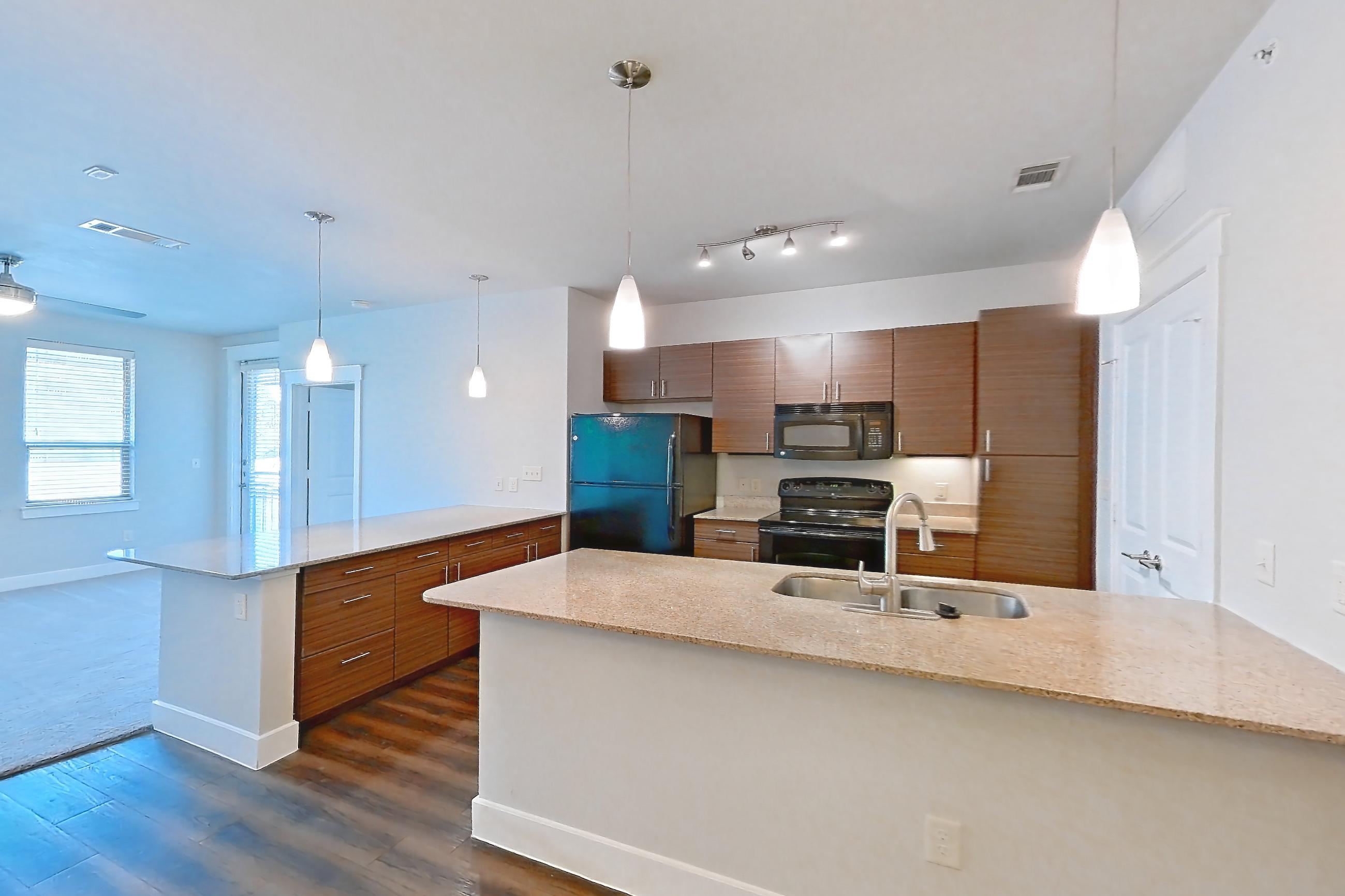 Dining room with black appliances, dark wood-finish flooring, electric range, light stone countertops, oven/range, and refrigerator, Apartment 04306 at Marquis Cresta Bella