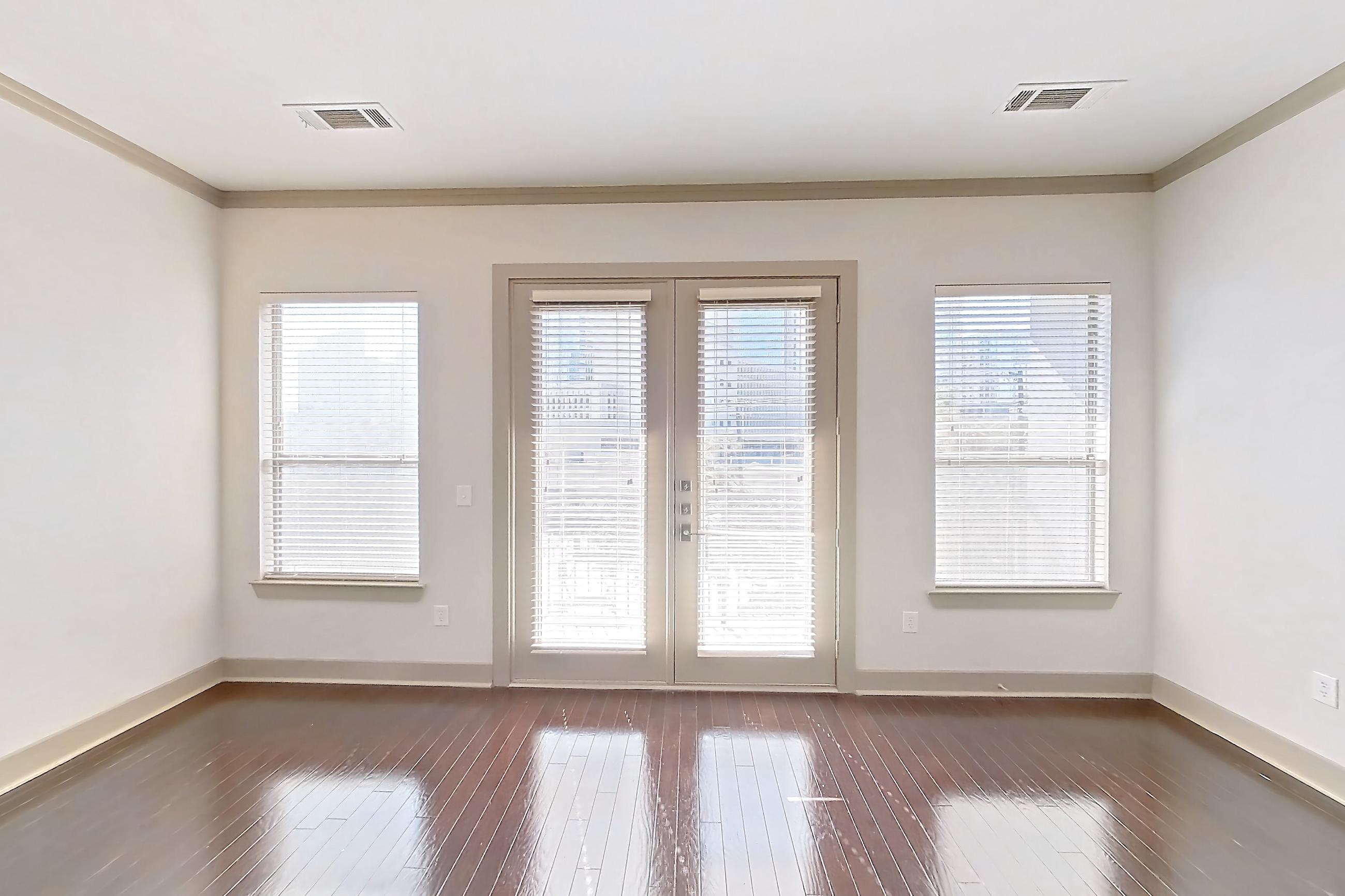 Living space with dark wood-finish flooring and wood-finish flooring, Apartment 309 at The Marquis of State Thomas