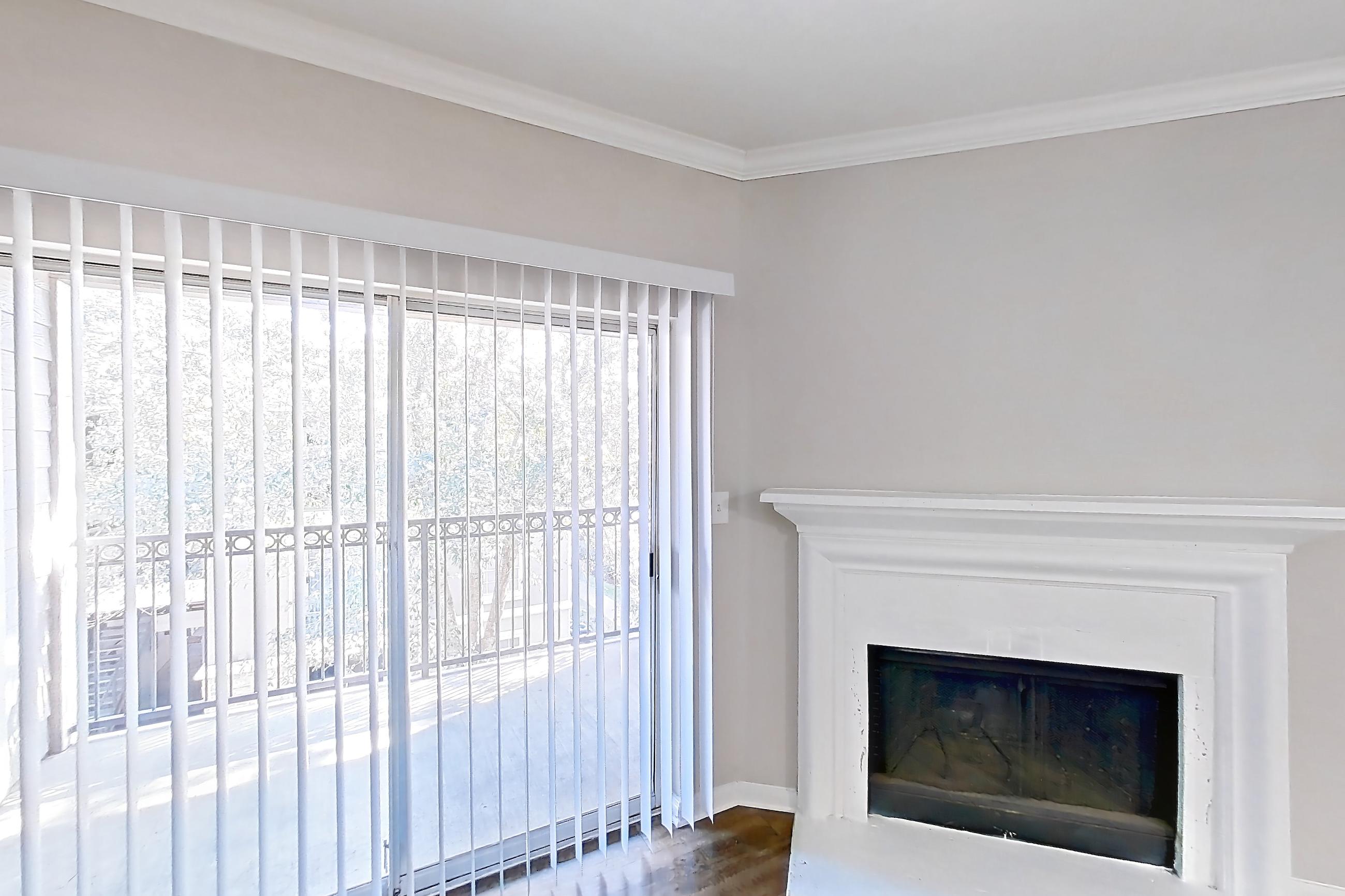 Living room with fireplace and marble fireplace, Apartment 0433 at Marquis on Westheimer