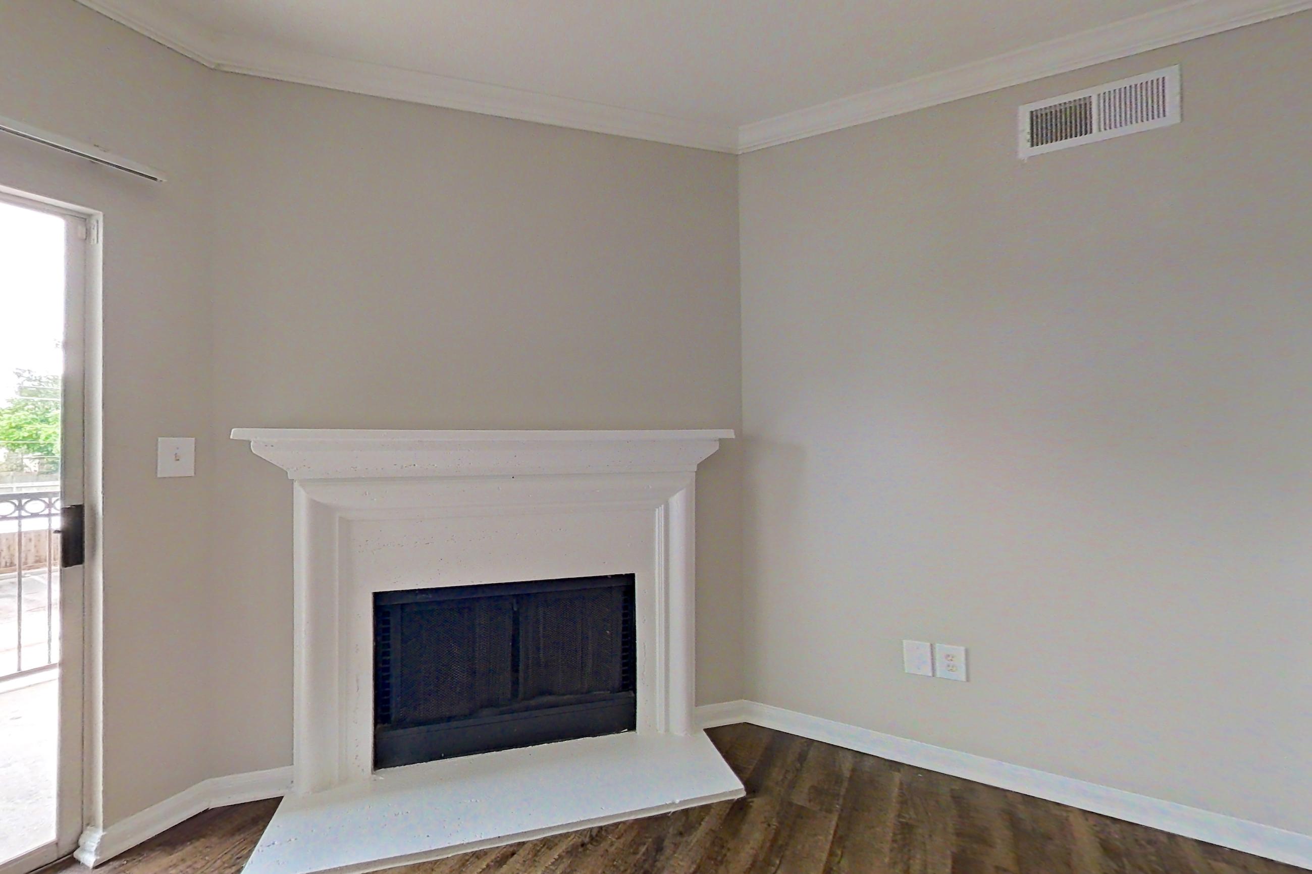 Living room with fireplace, Apartment 0525 at Marquis on Westheimer