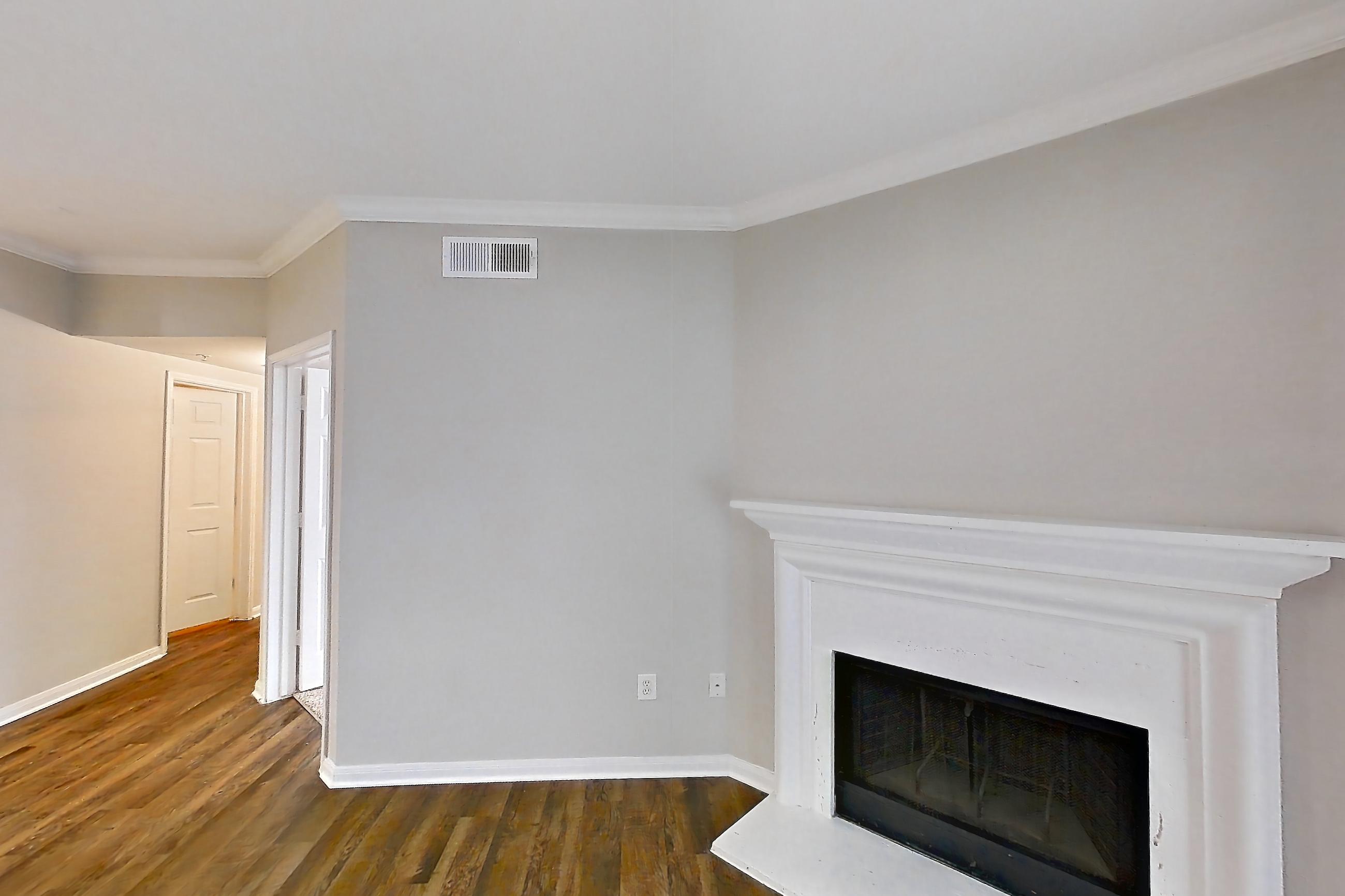 Living room with dark wood-finish flooring, Apartment 0934 at Marquis on Westheimer