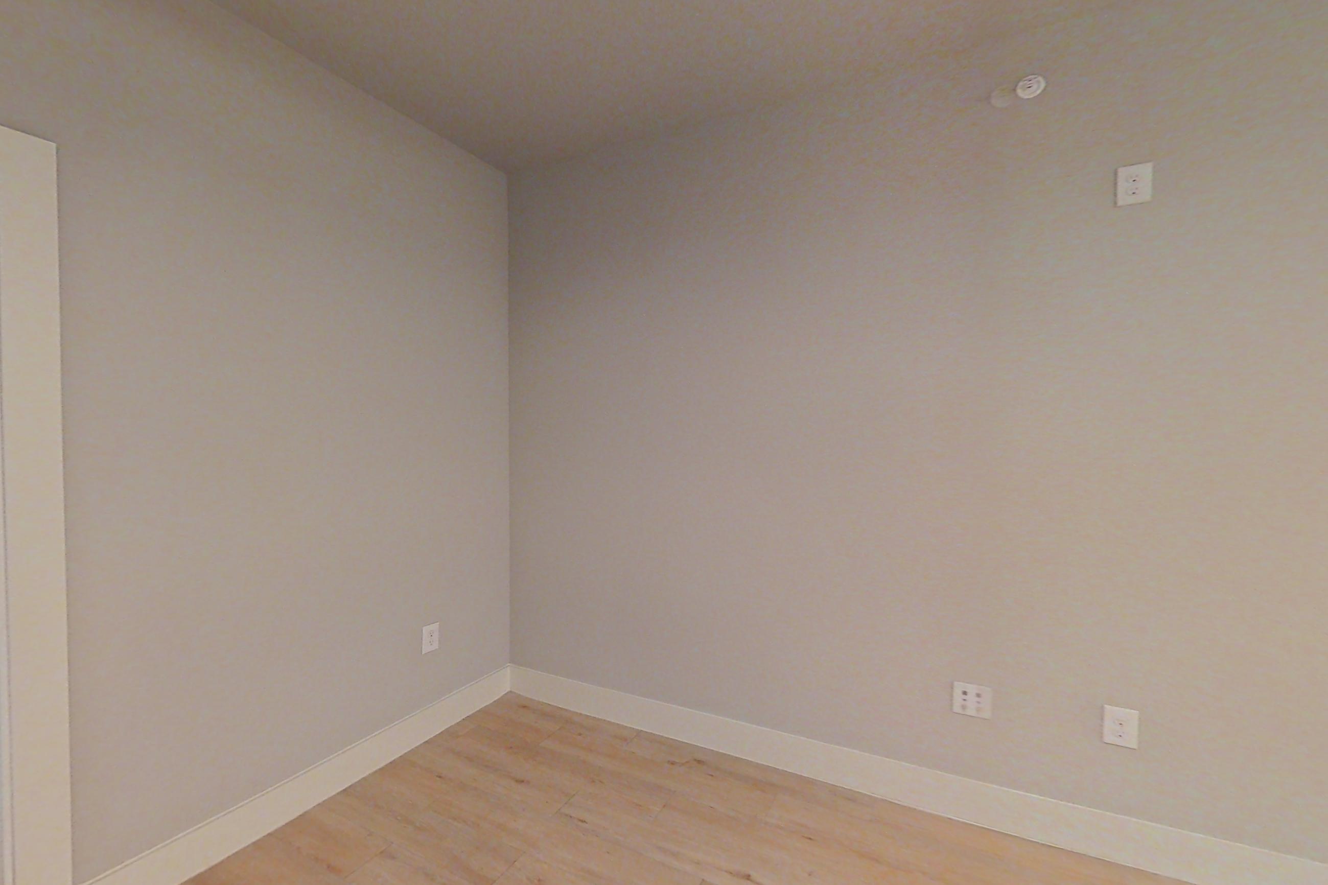 Living room with light wood-finish flooring, Apartment 1409 at Marquis Dominion