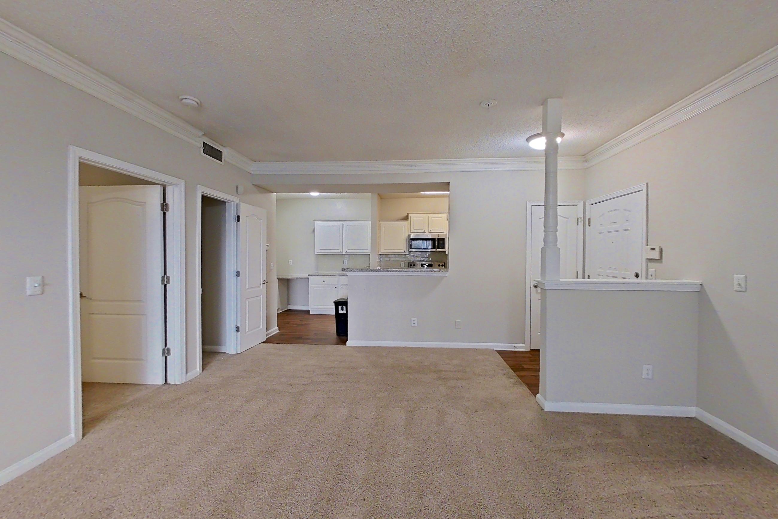 Living room with microwave and stainless steel appliances, Apartment 206 at Marquis Midtown West