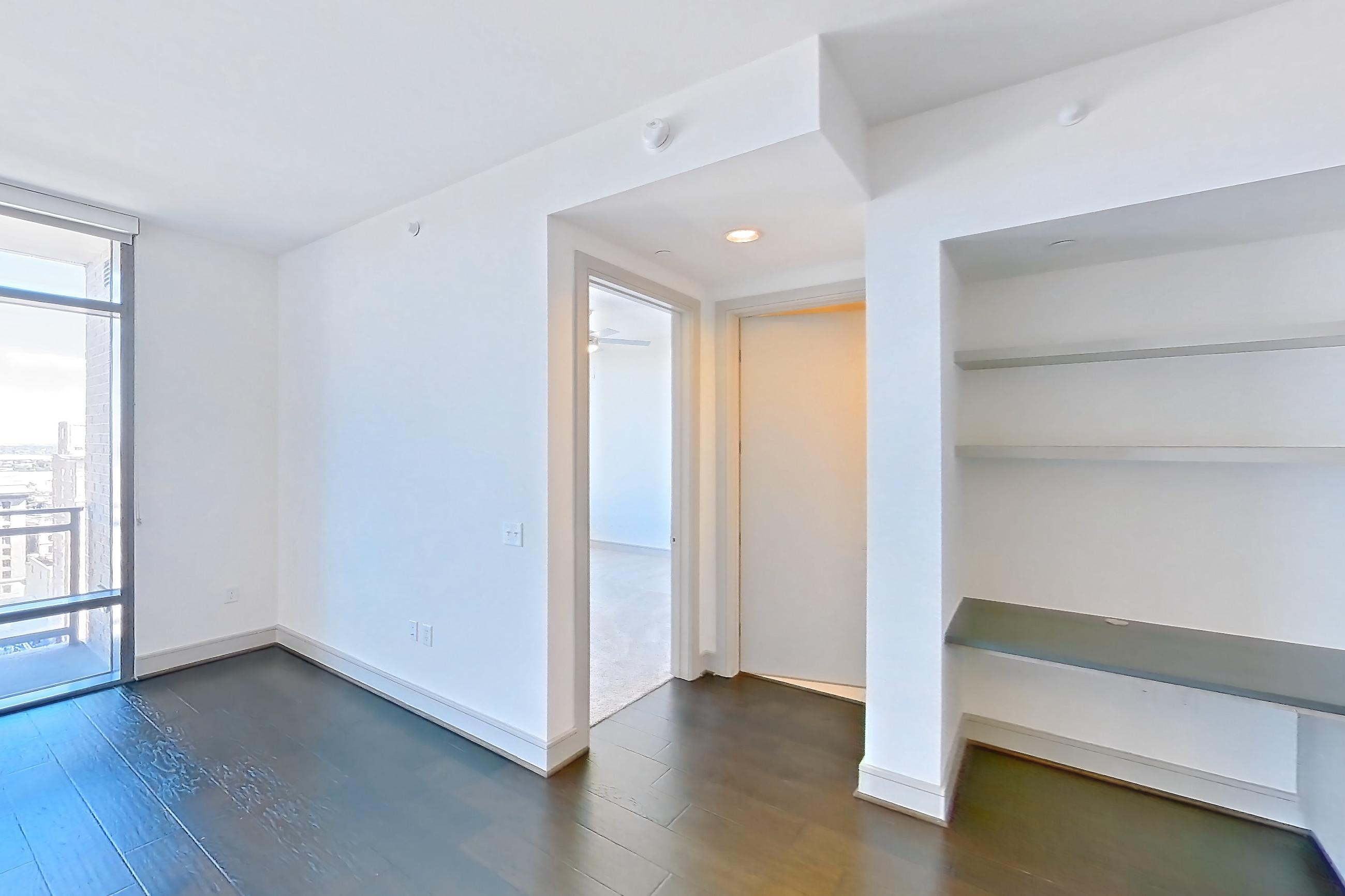 Living space with dark wood-finish flooring and wood-finish flooring, Apartment 1608 at Aris Market Square