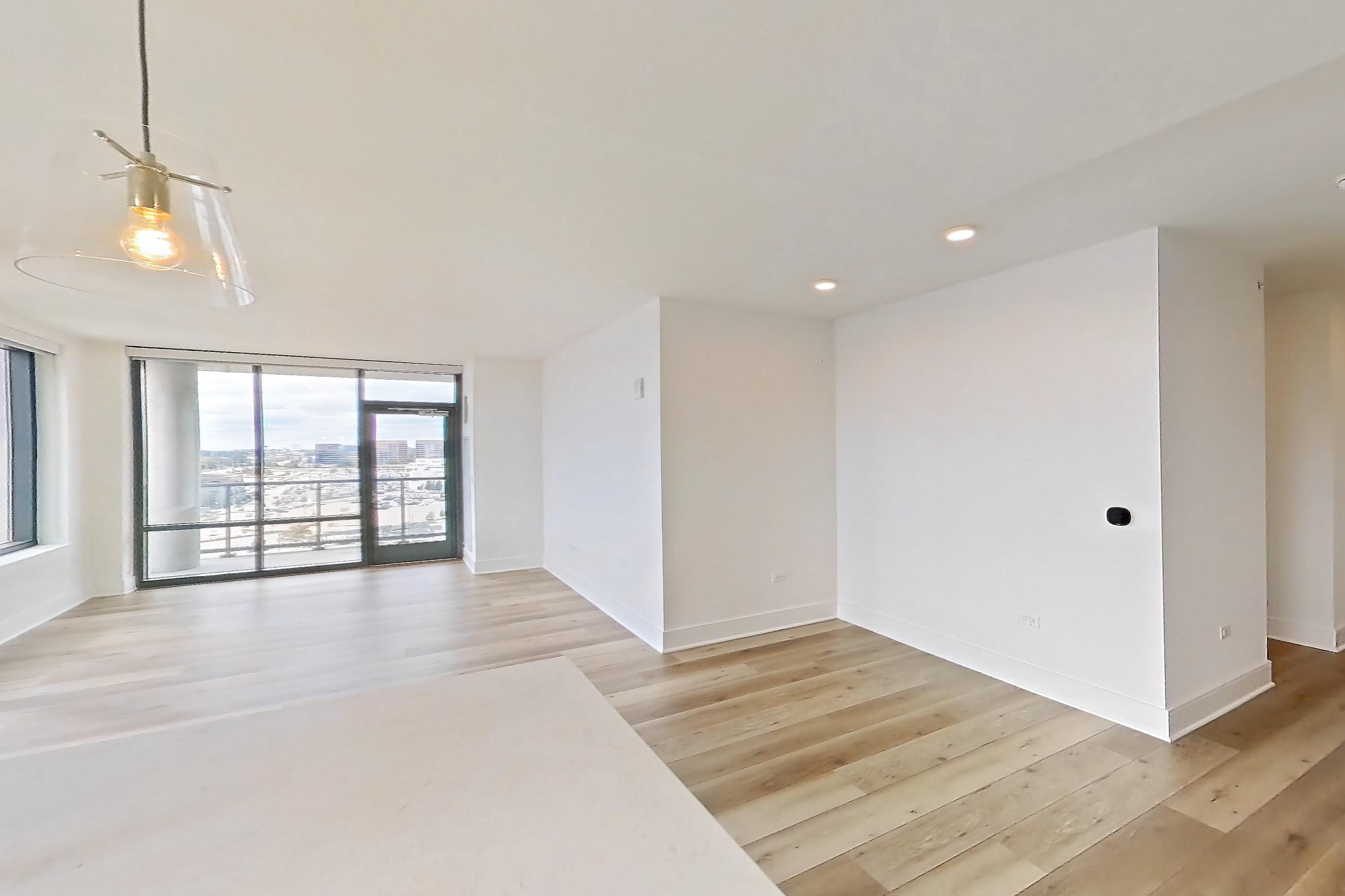 Kitchen with dishwasher, gas range, light stone countertops, light wood-finish flooring, oven/range, and stainless steel appliances, Apartment 1020 at One Oak Brook Commons