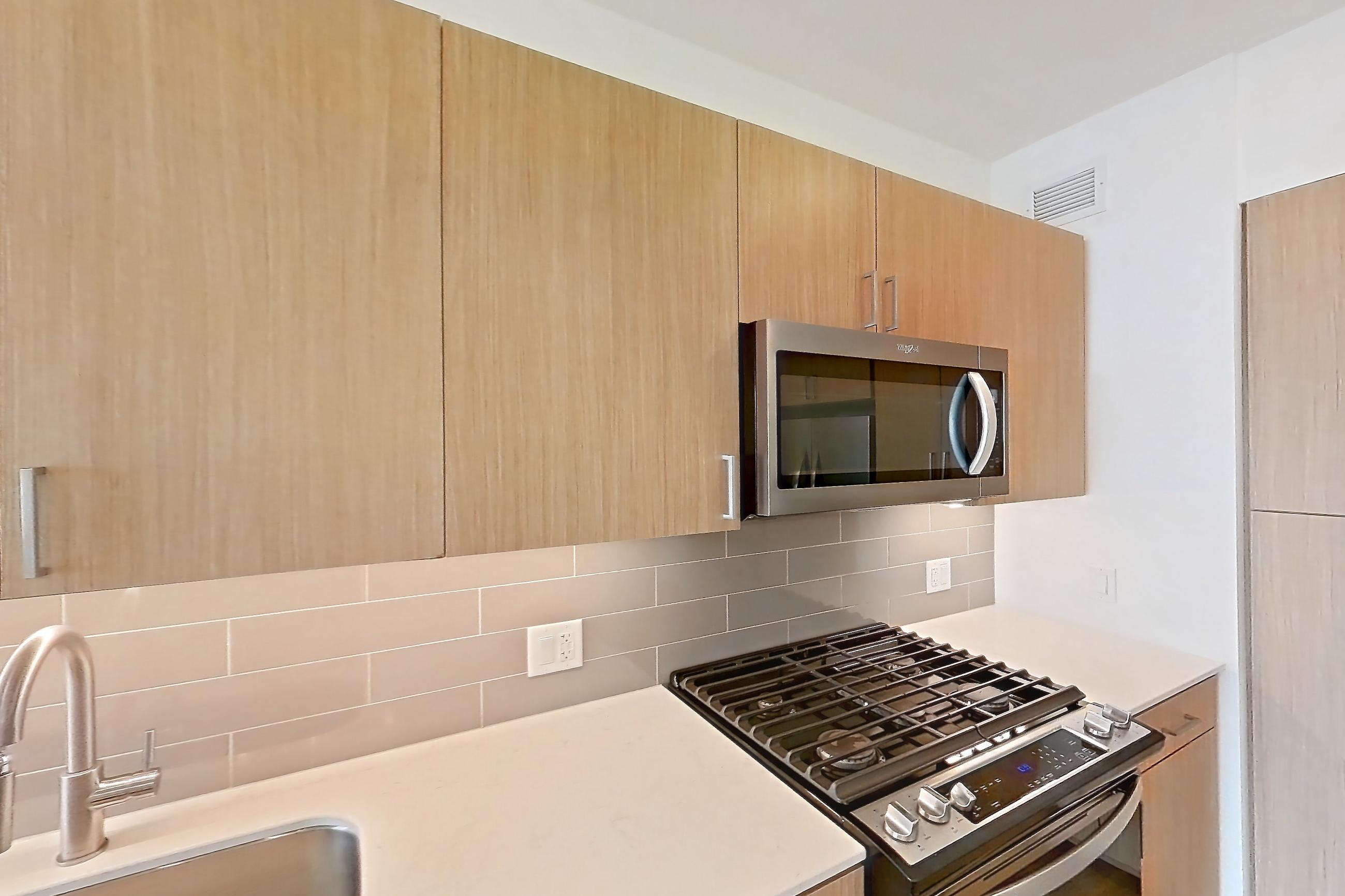 Kitchen in Apartment 1215 at One Oak Brook Commons, F1.2 floor plan