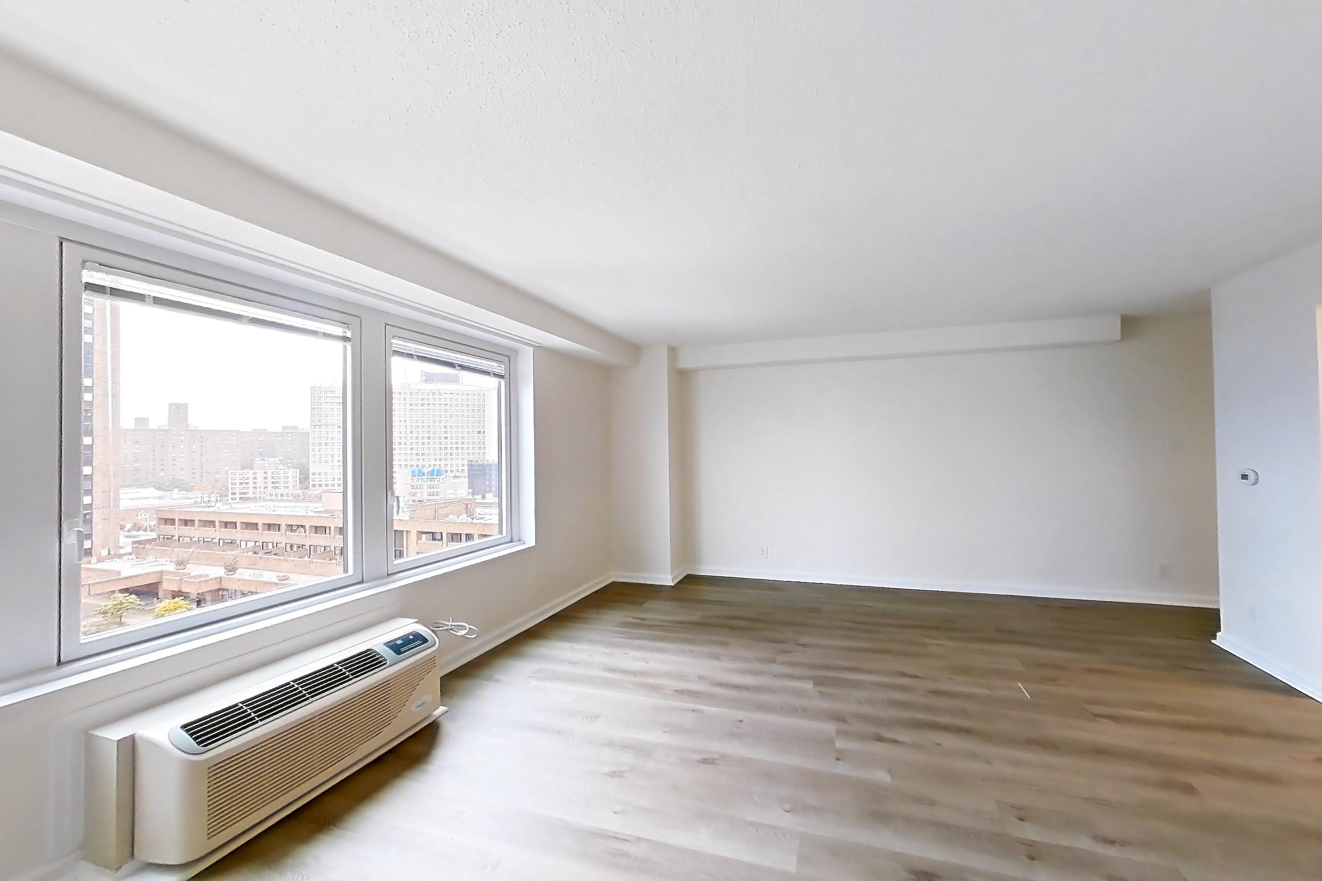 Living room in Apartment 30-08b at Waterside Plaza, 1H floor plan