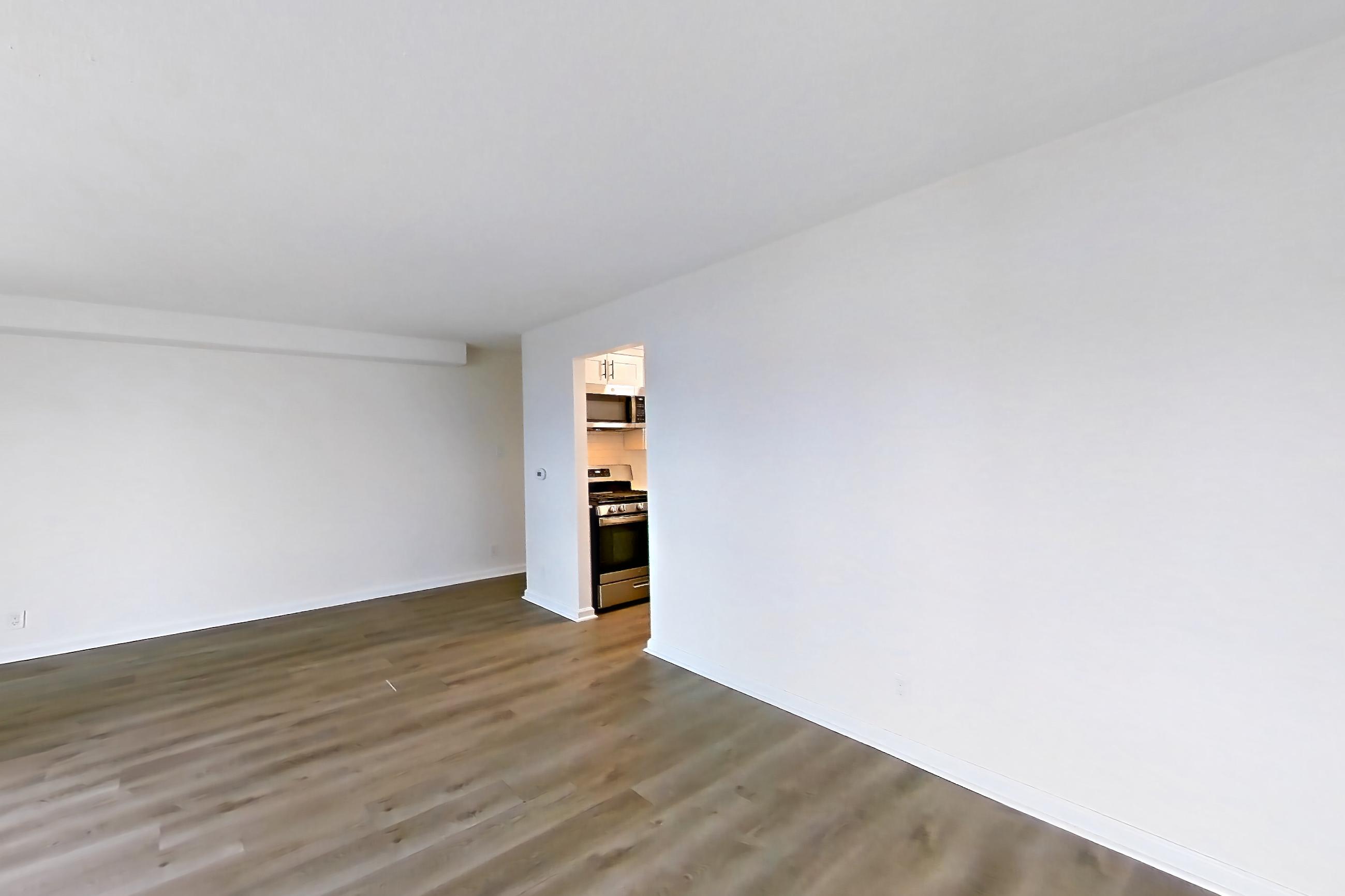 Living room in Apartment 30-08b at Waterside Plaza, 1H floor plan