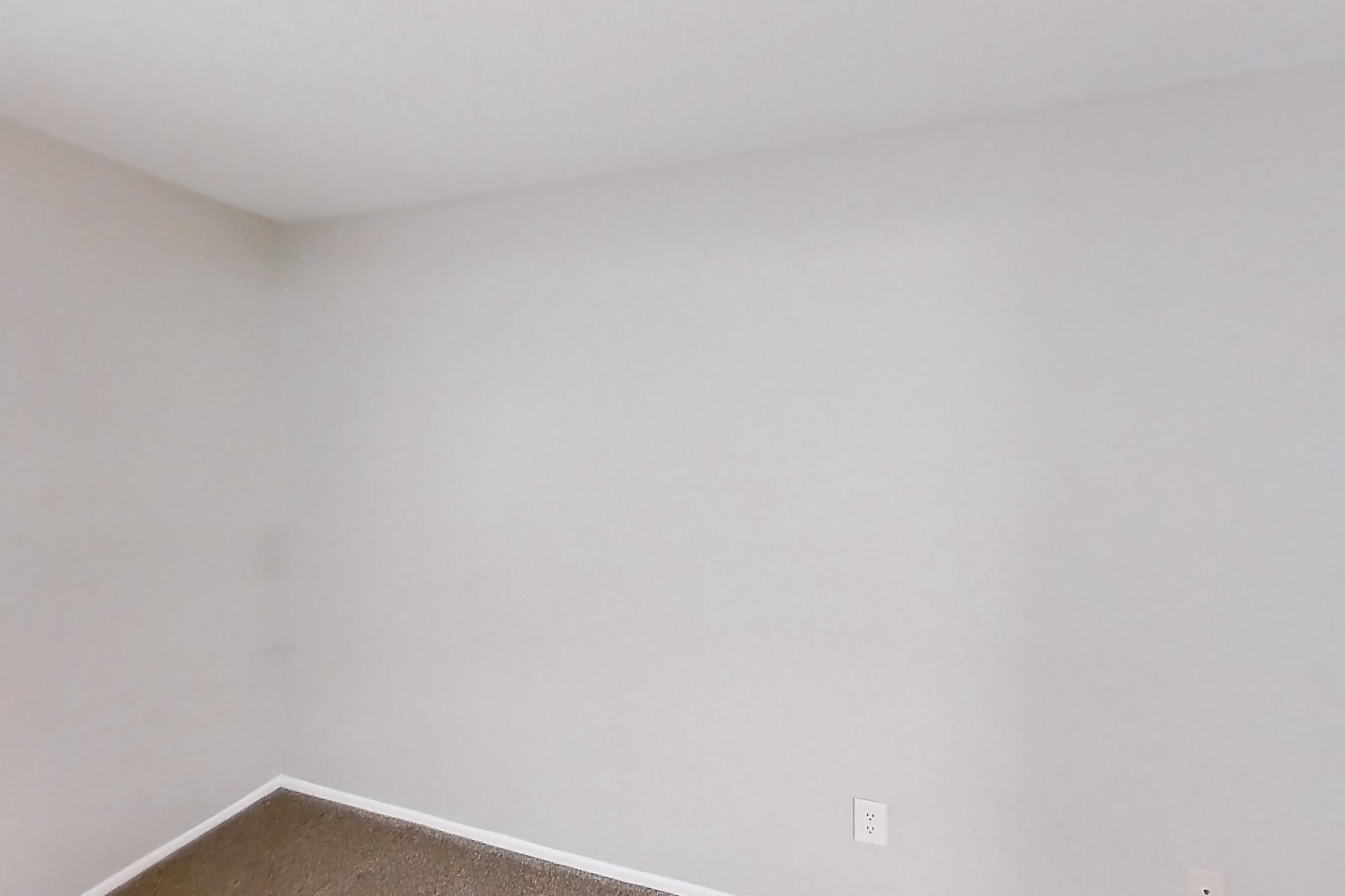 Living space with dark carpet, Apartment 02 at Avana Rancho Cucamonga