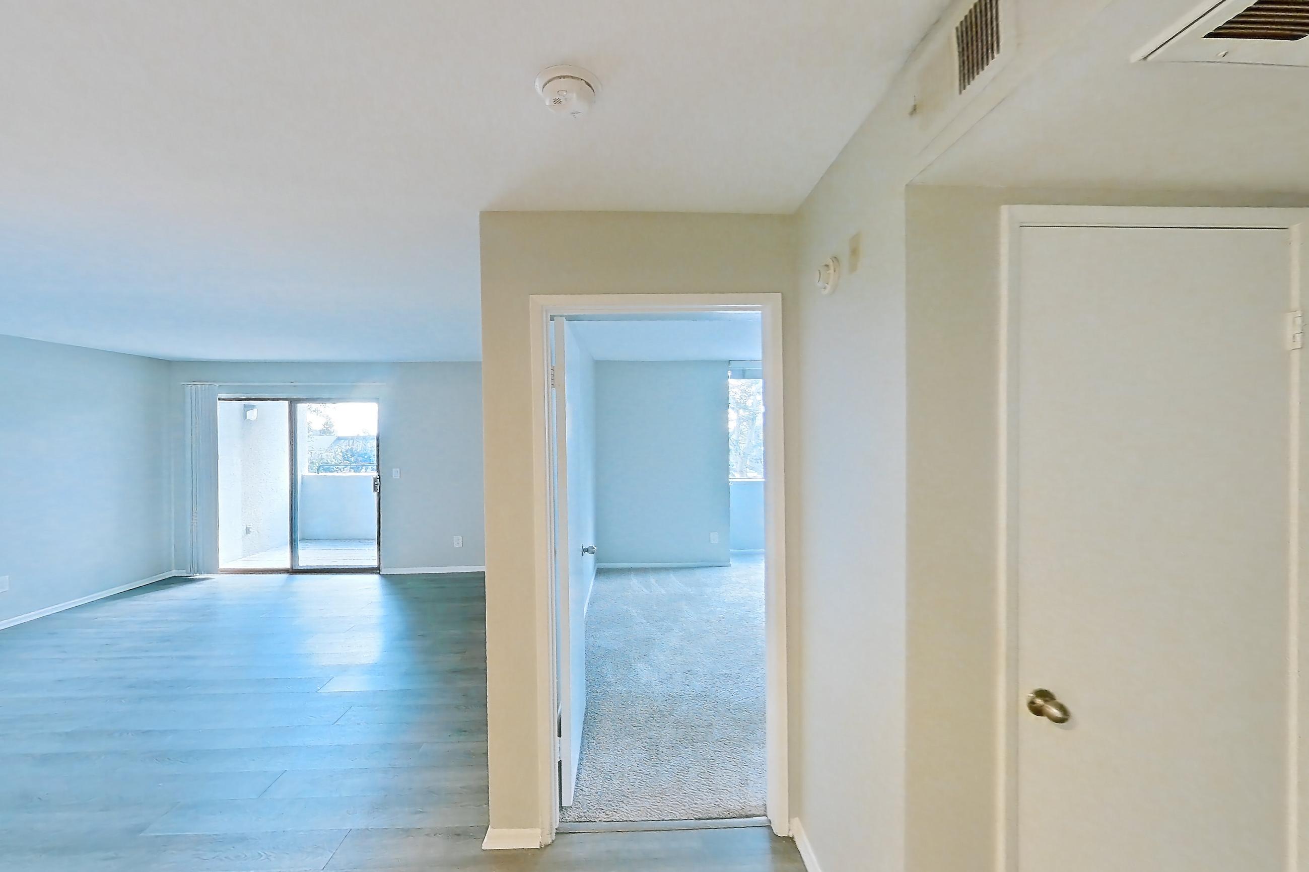 Dining room with electric range, light wood-finish flooring, oven/range, and stainless steel appliances, Apartment 09 at Avana Rancho Cucamonga