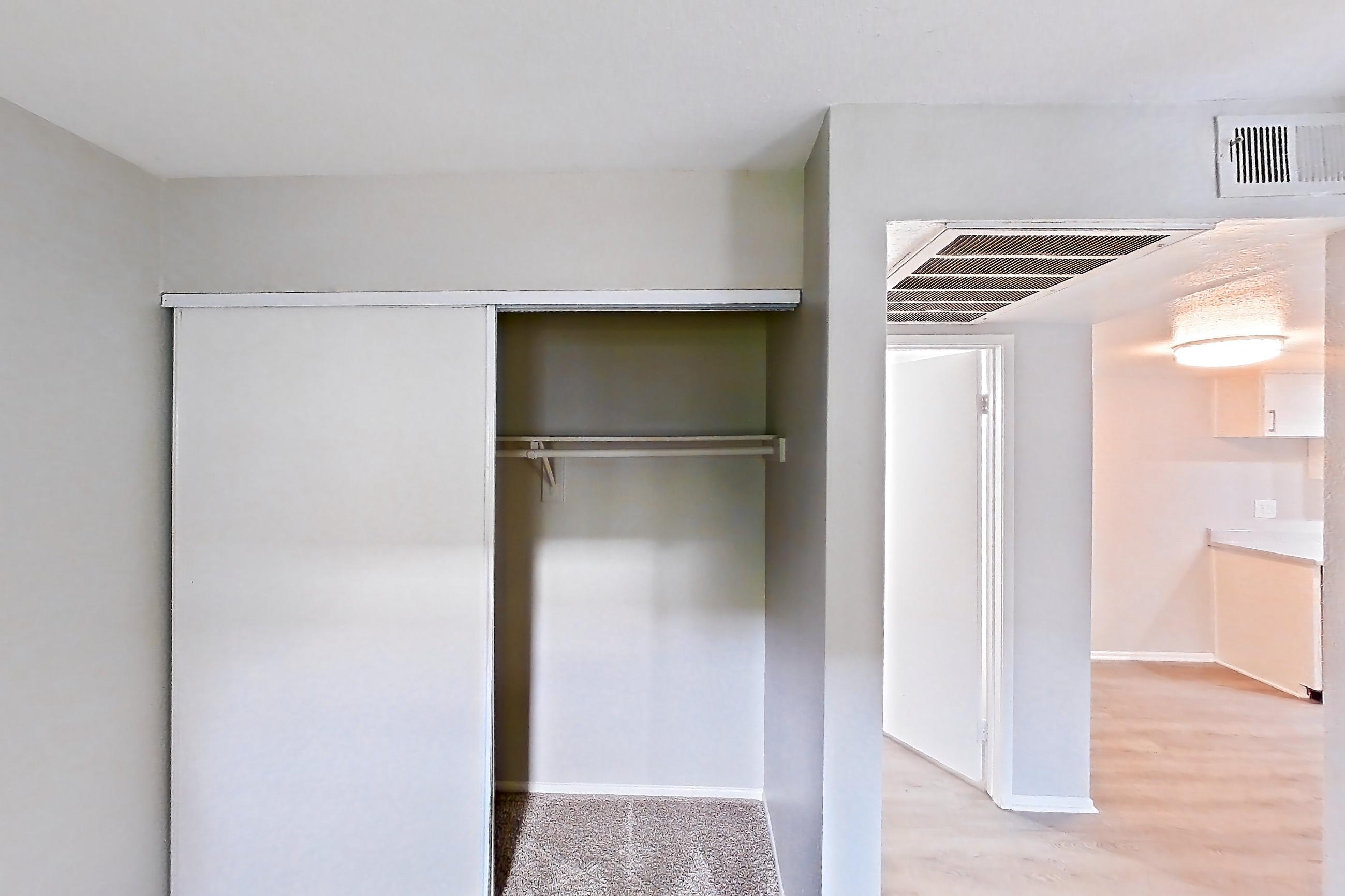 Living space with light carpet, Apartment 06 at Avana Rancho Cucamonga