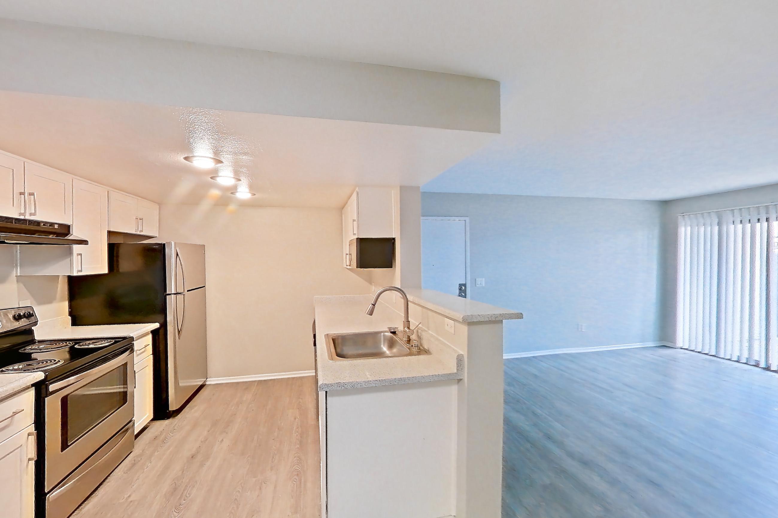 Dining room with light countertops and light wood-finish flooring, Apartment 01 at Avana Rancho Cucamonga
