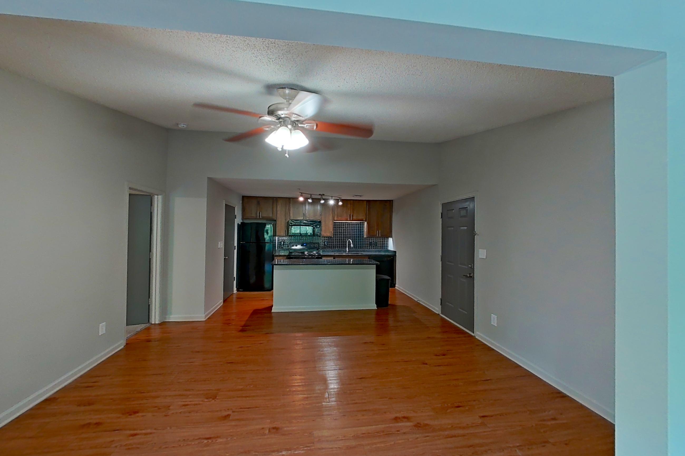 Living space with black appliances, electric range, and oven/range, Apartment 8304 at Cortland 3131