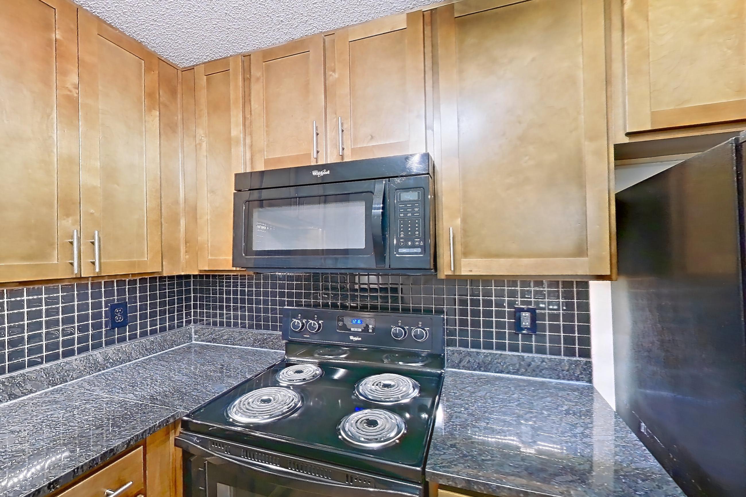 Kitchen in Apartment 9004 at Cortland 3131, A2R - Oxford floor plan