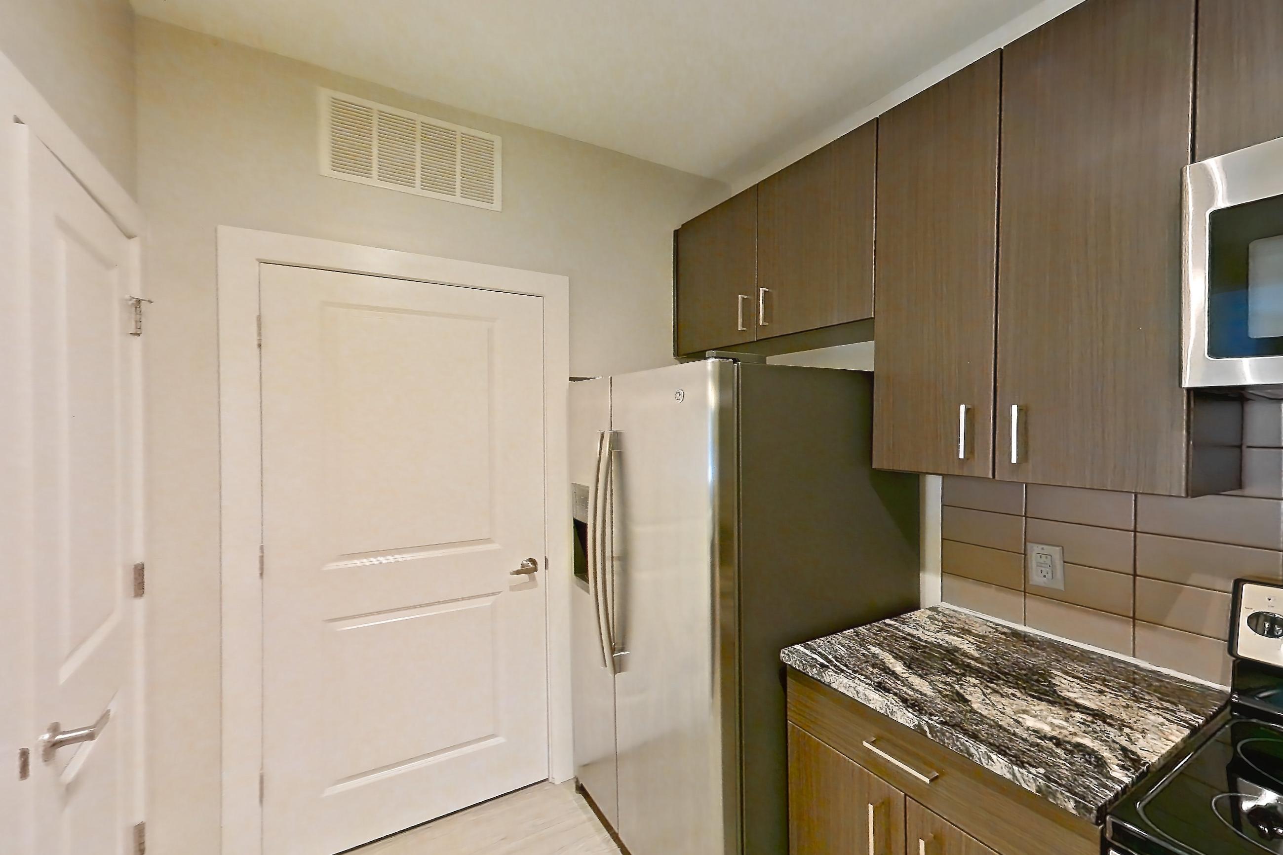 Kitchen in a B9 - Eton floor plan apartment, representative of Apartment 6101 at Cortland Wren Northlake