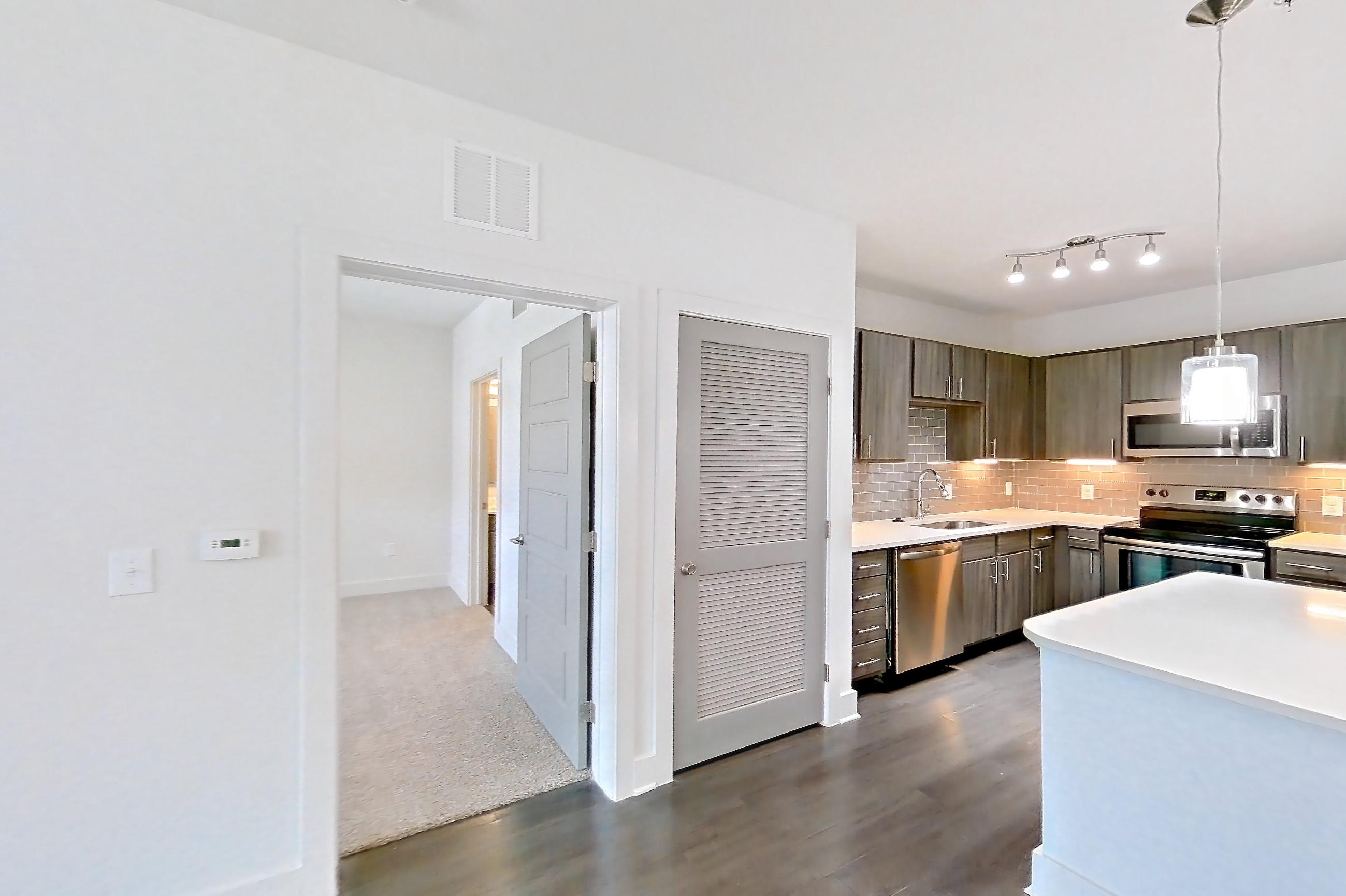 Dining room with dark wood-finish flooring, Apartment 01 - 2151 at Cortland Allen Station