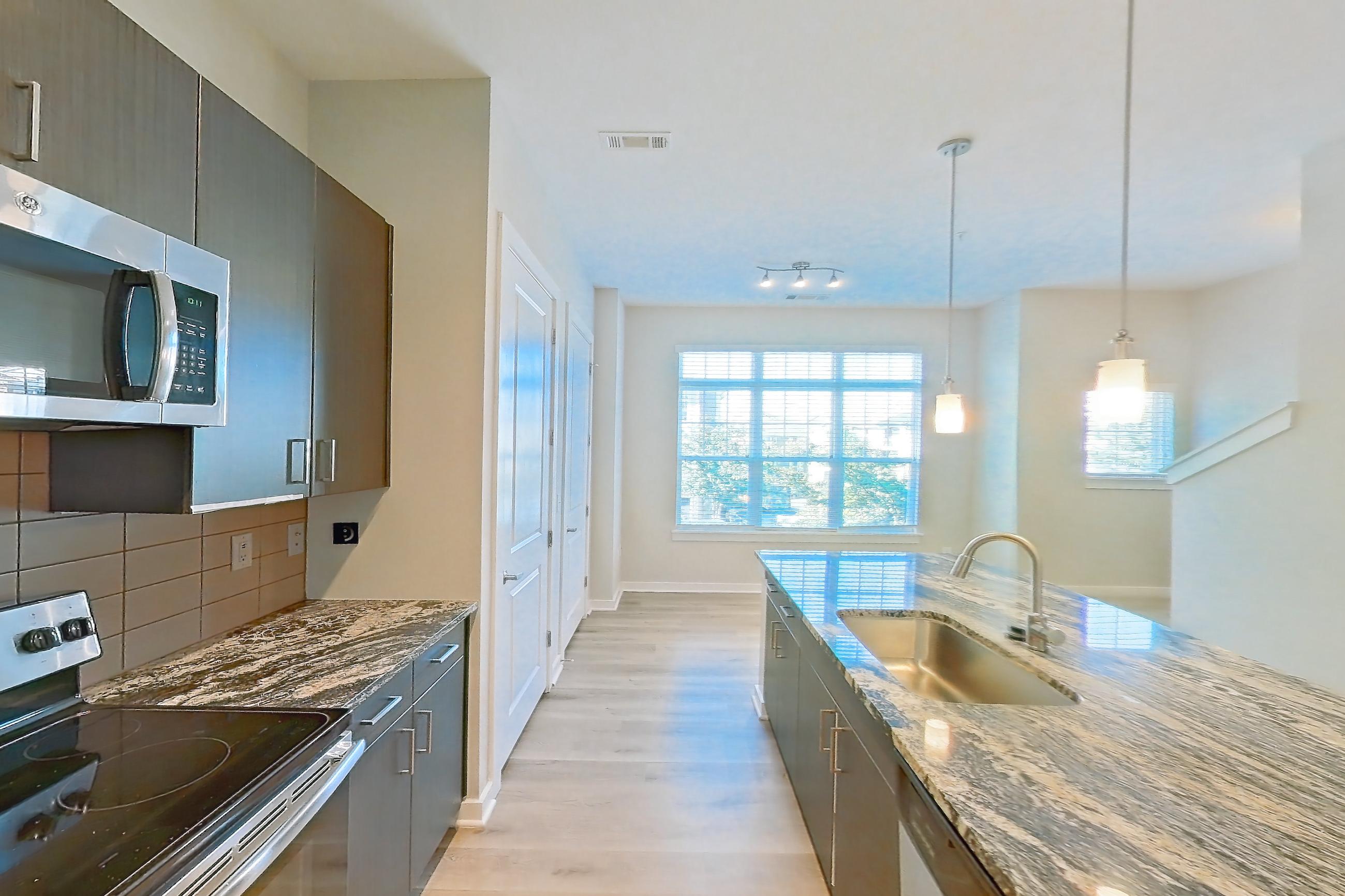 Kitchen in a B17 - Seafoam floor plan apartment, representative of Apartment 3104 at Cortland Wren Northlake