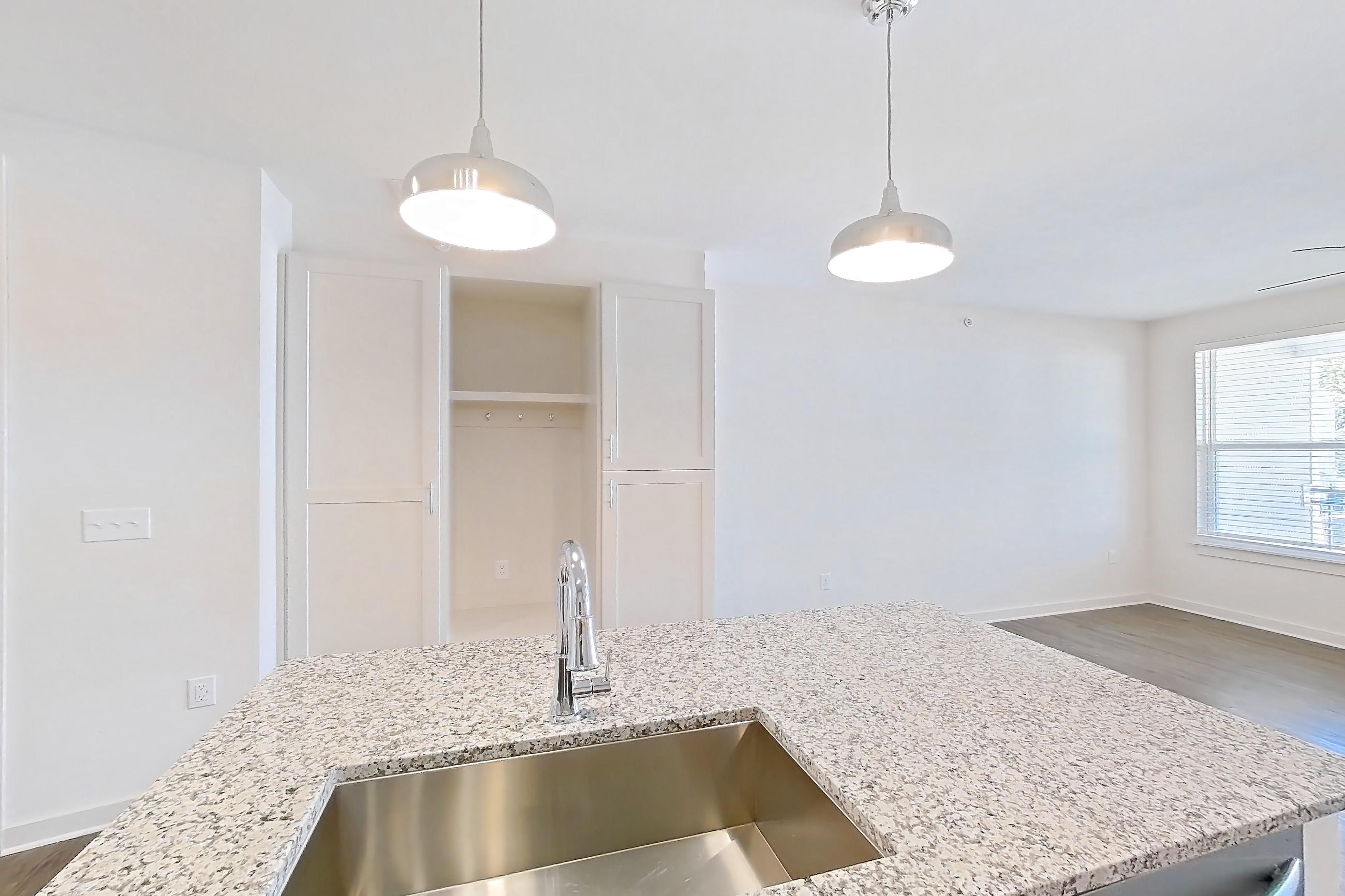 Kitchen in a A5 - Carolina floor plan apartment, representative of Apartment 2-105 at Cortland Wren Northlake